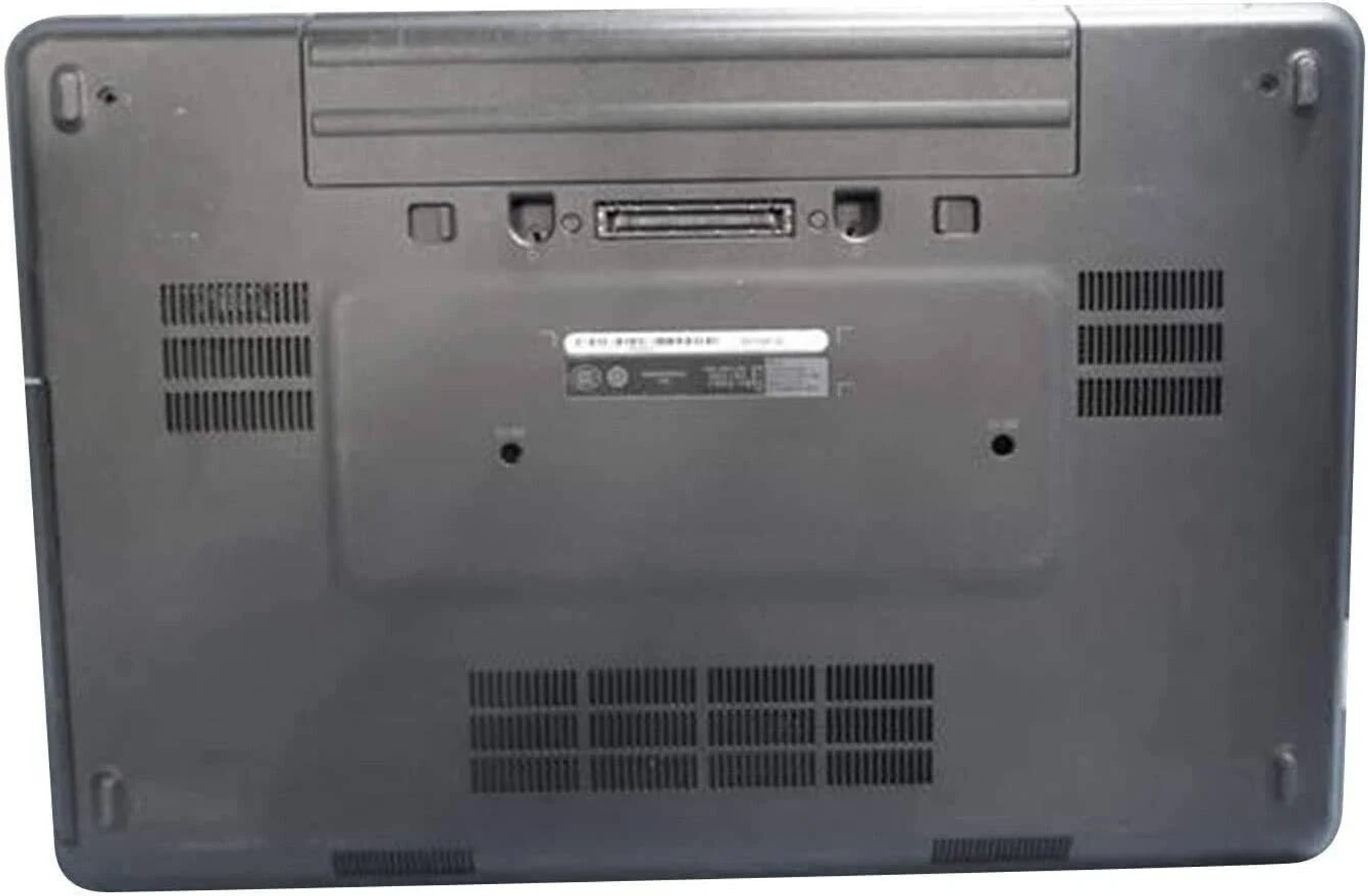 Spód ciemnoszarego laptopa z otworami wentylacyjnymi.