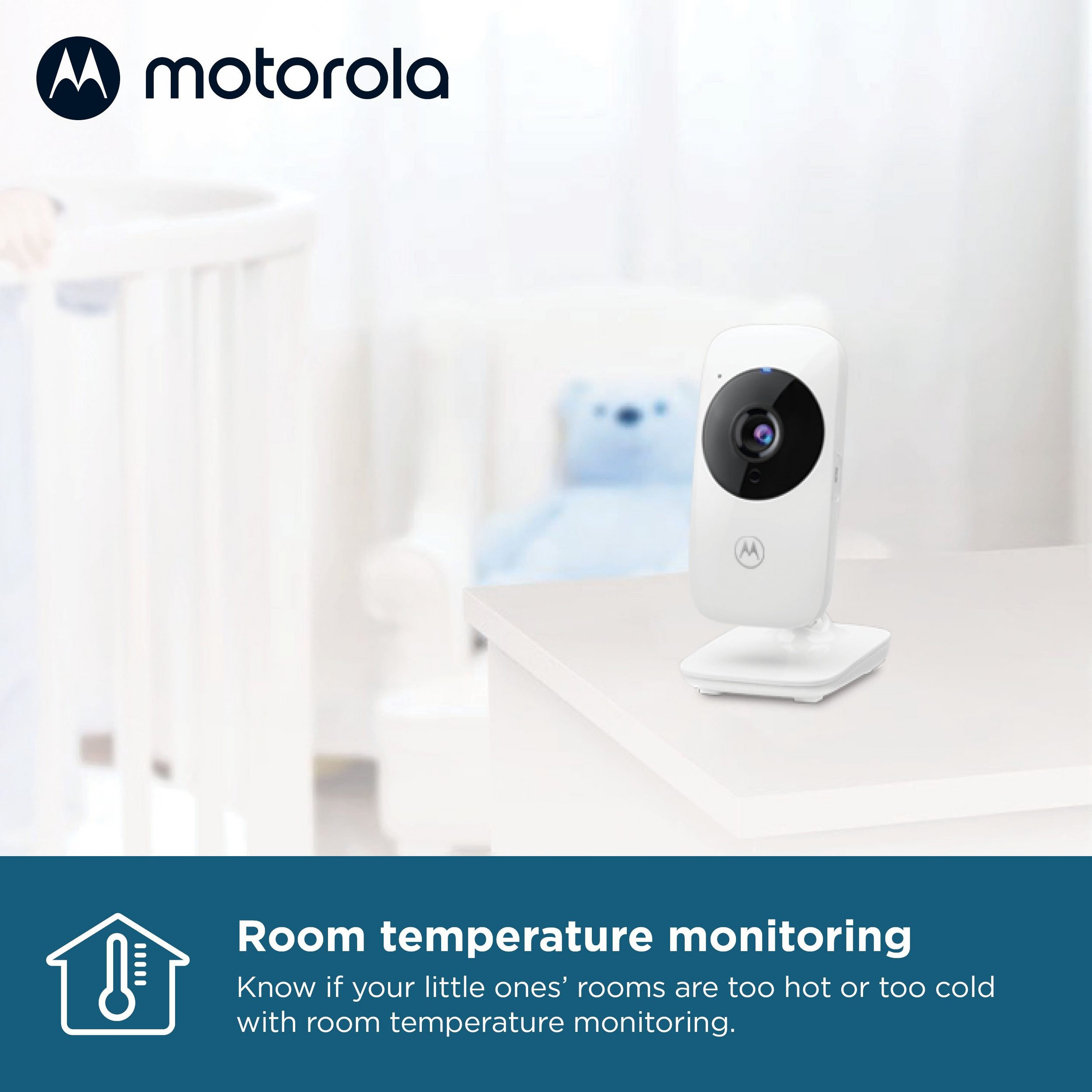 Baby monitor Motorola su un tavolo bianco. Una culla sullo sfondo. Testo: Monitoraggio della temperatura ambiente.