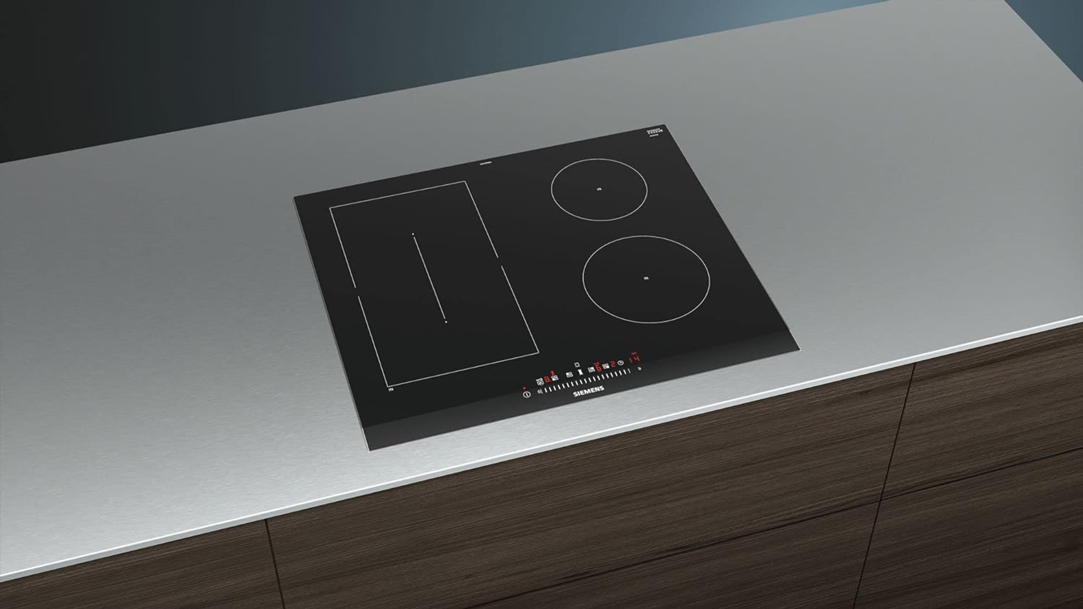 Black stovetop with 3 burners. Silver countertop. Brown cabinet below.