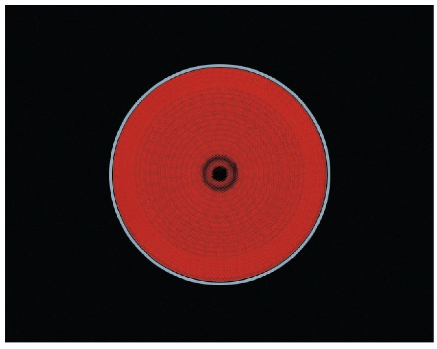 Czerwone, okrągłe źródło ciepła z ciemnym środkiem na czarnej powierzchni.