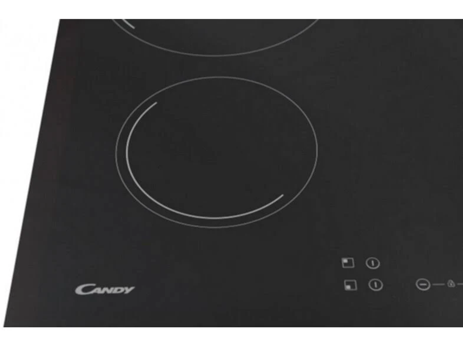 Zbliżenie czarnej płyty grzewczej z dwoma okrągłymi strefami gotowania.