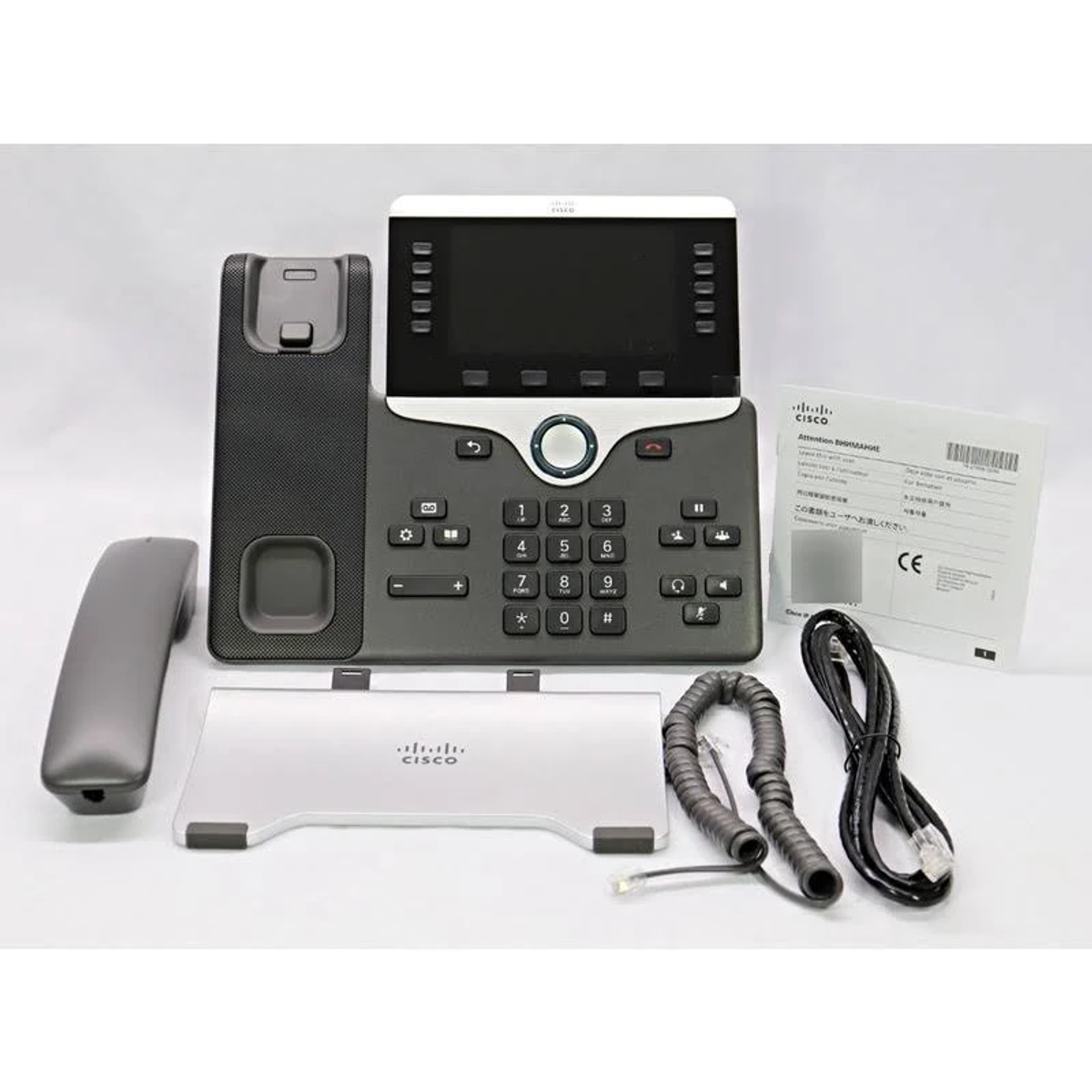 Telefon IP Cisco z wyświetlaczem, przyciskami i słuchawką.