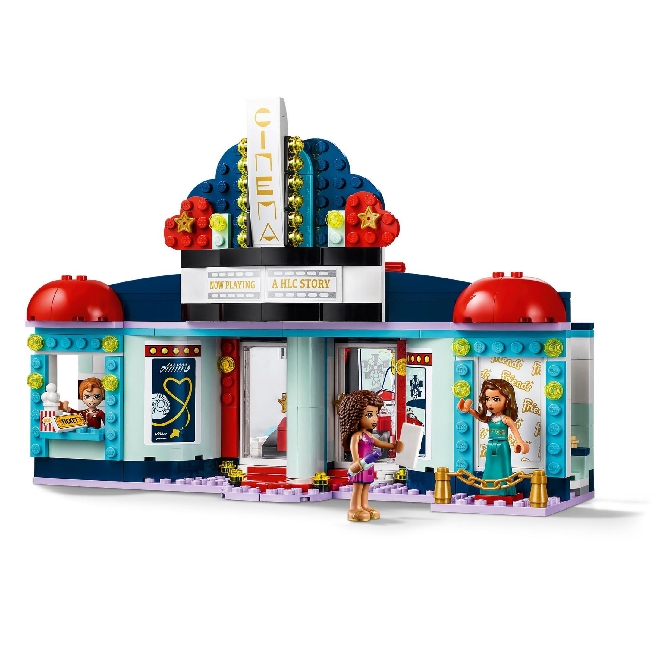 Set de cine Lego. Un edificio con un letrero que dice 'CINEMA'. Figuras de personas frente al edificio.