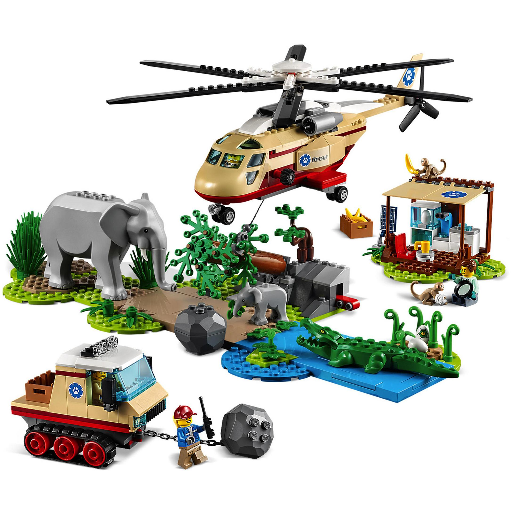 Zestaw Lego z helikopterem, słoniem, ciężarówką i sceną z krokodylami i małpami.