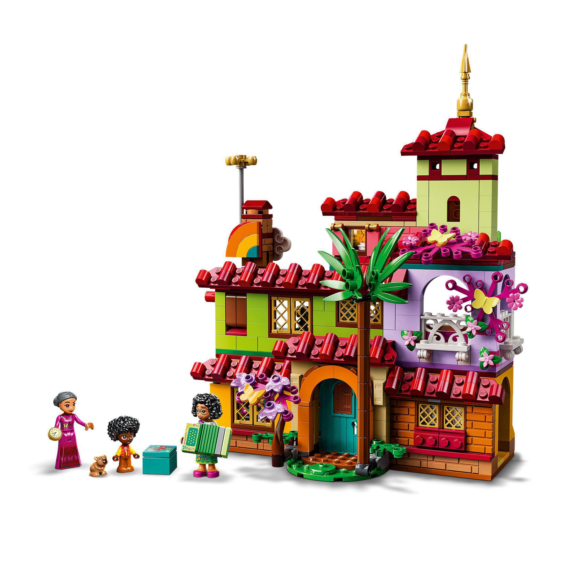 Lego-Set eines bunten Hauses. Figuren von Menschen und einem Hund stehen vor dem Haus. Es ist ein Lego-Spielzeug.