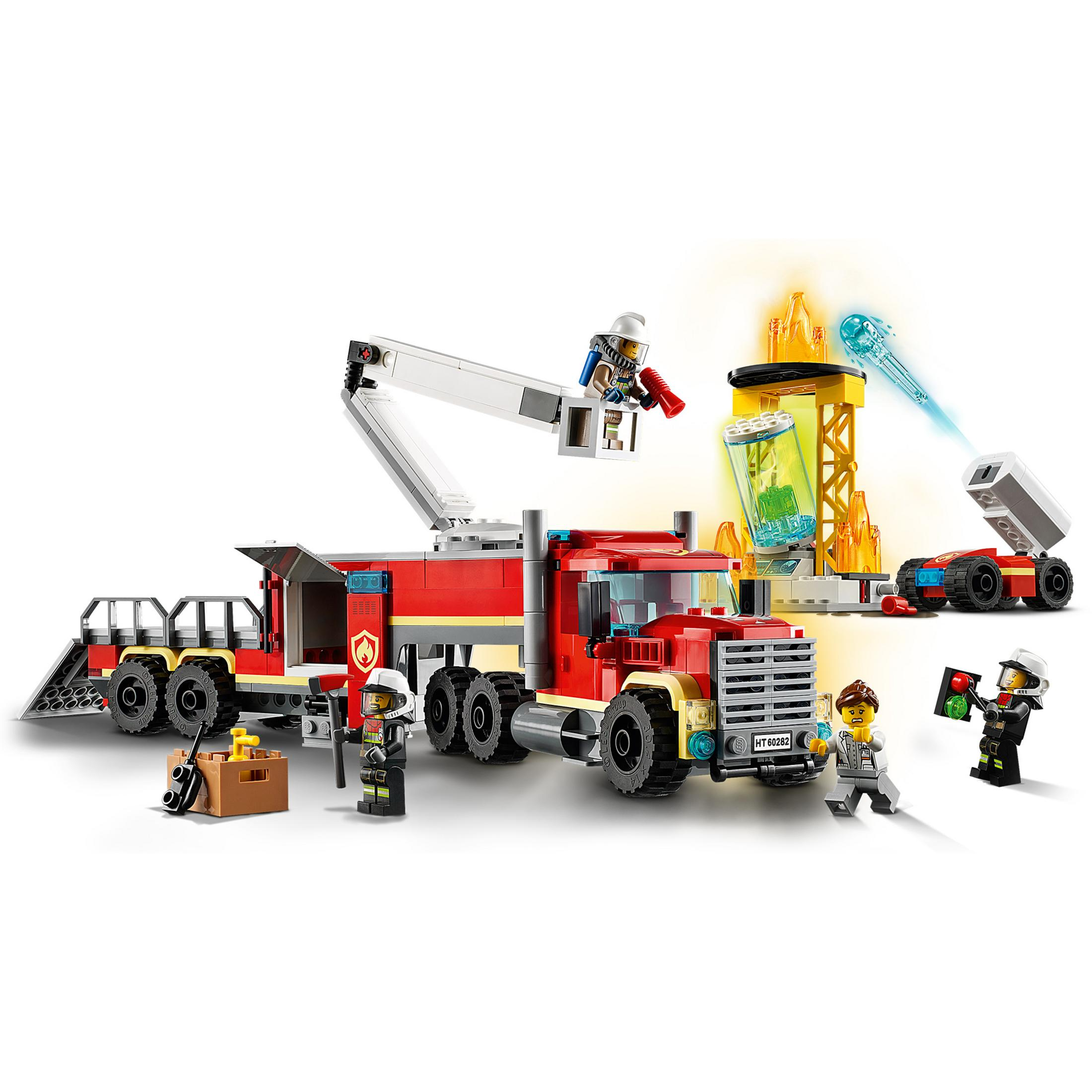 Camion dei pompieri LEGO City: camion rosso con scala, pompieri e edificio in fiamme.