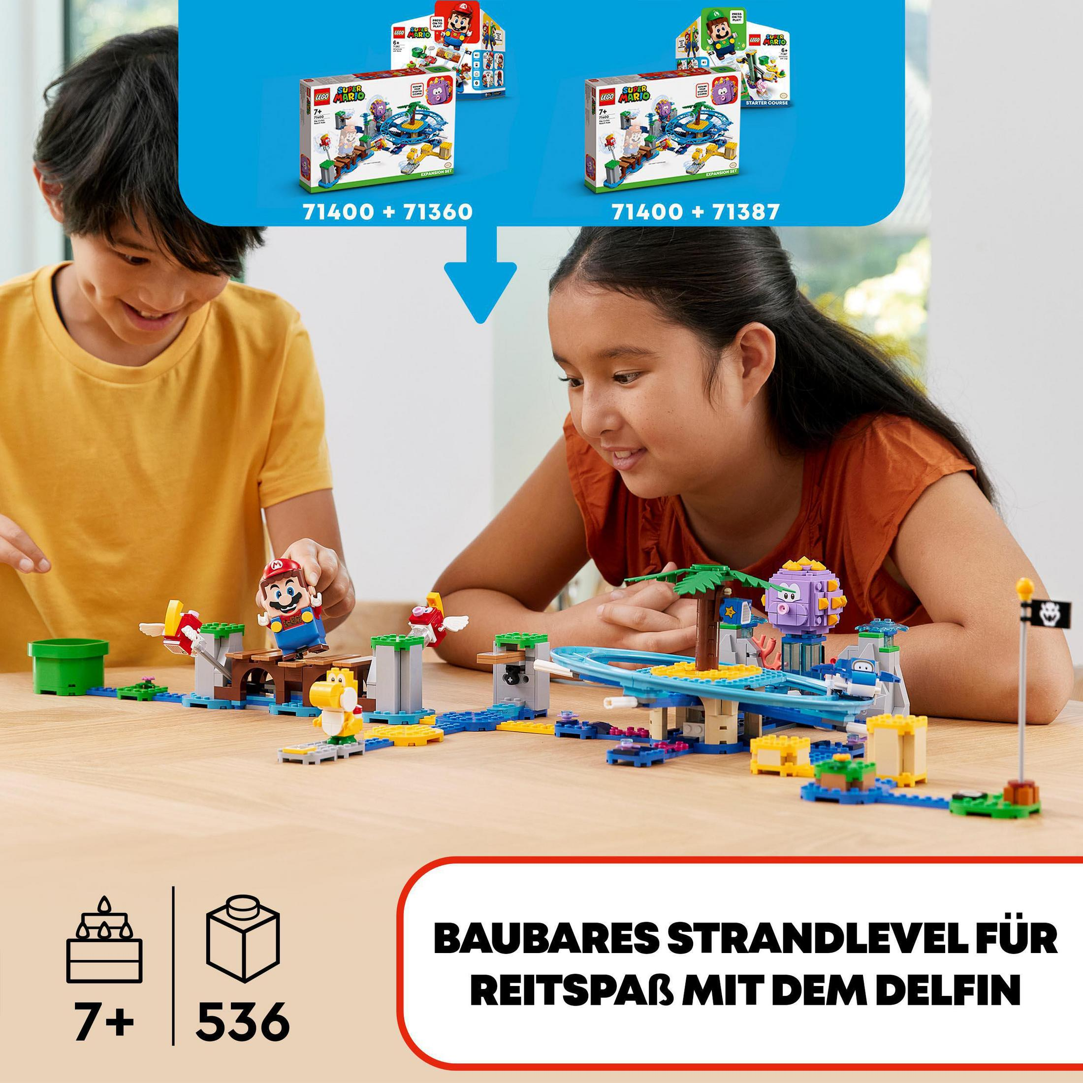Zwei Kinder bauen ein LEGO Mario Strandlevel. Kisten mit LEGO Sets im Hintergrund.