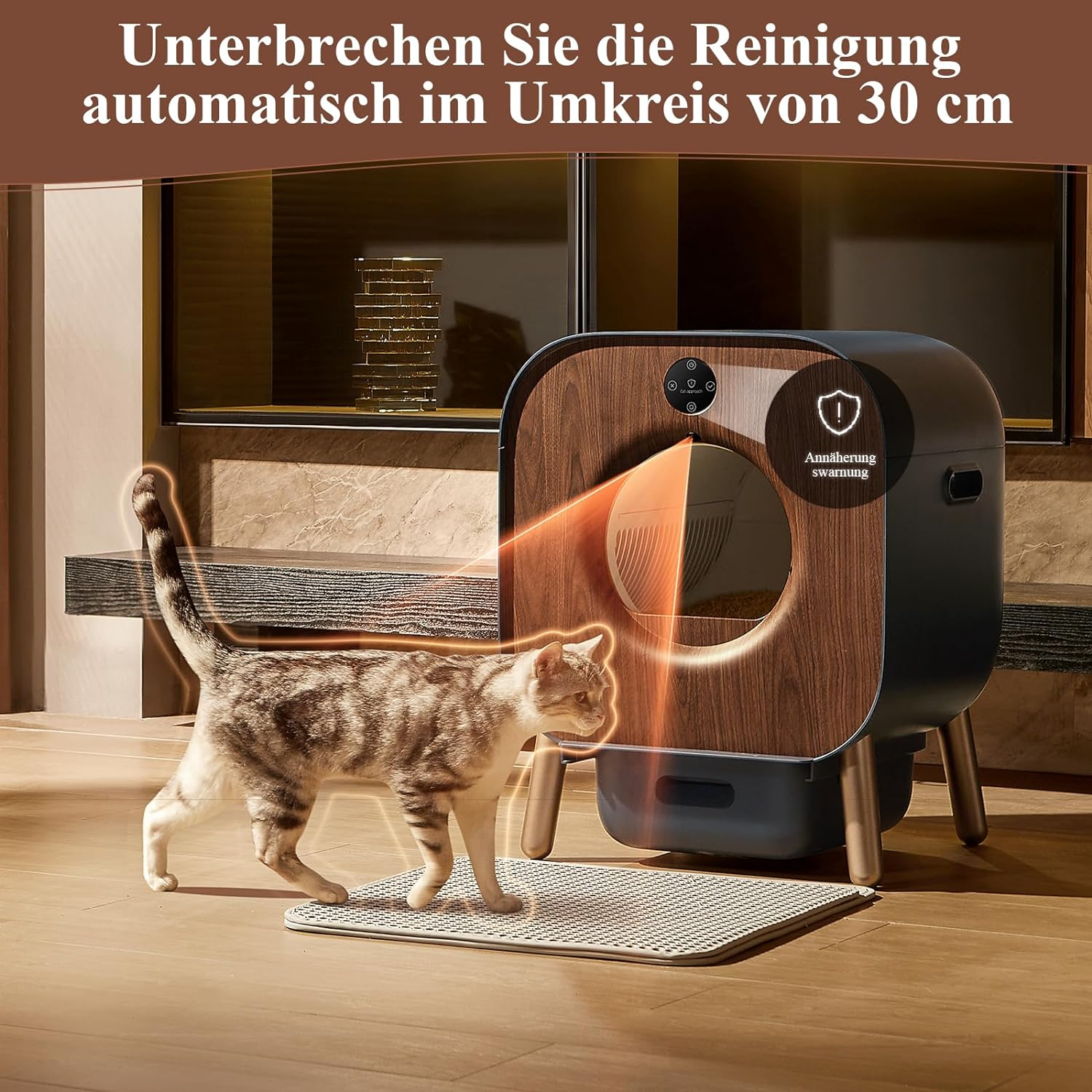 Eine Katze geht auf eine Katzentoilette zu. Die Box ist braun und hat eine Holzoptik.