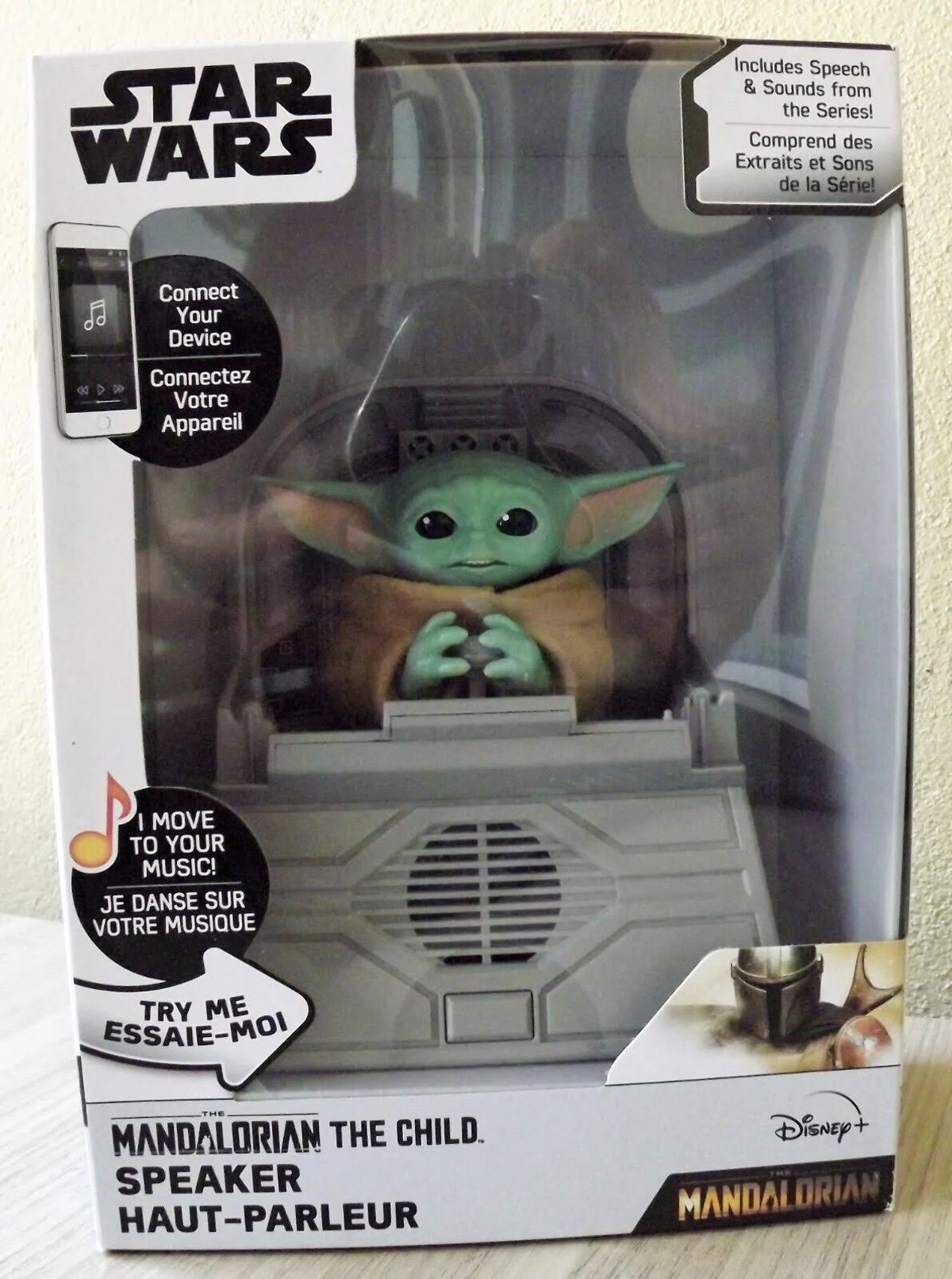 Juguete de altavoz de The Mandalorian en su caja, mostrando a Grogu.