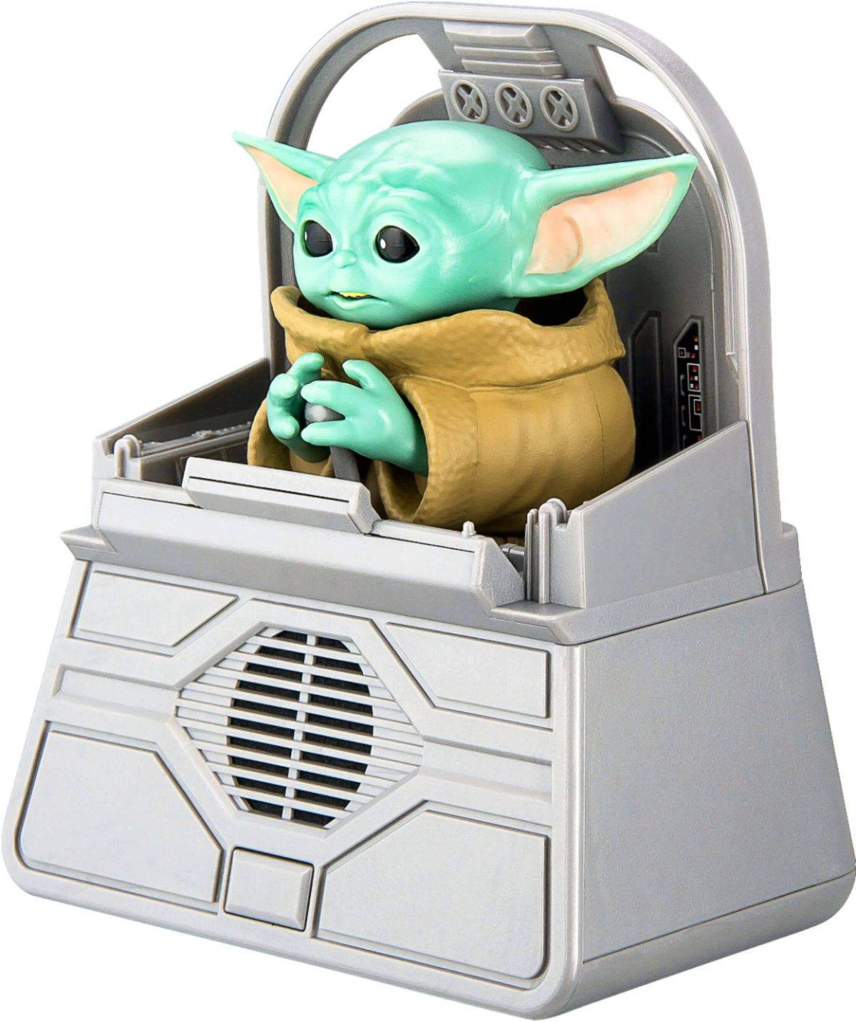 Un juguete de Baby Yoda en un asiento de nave espacial.