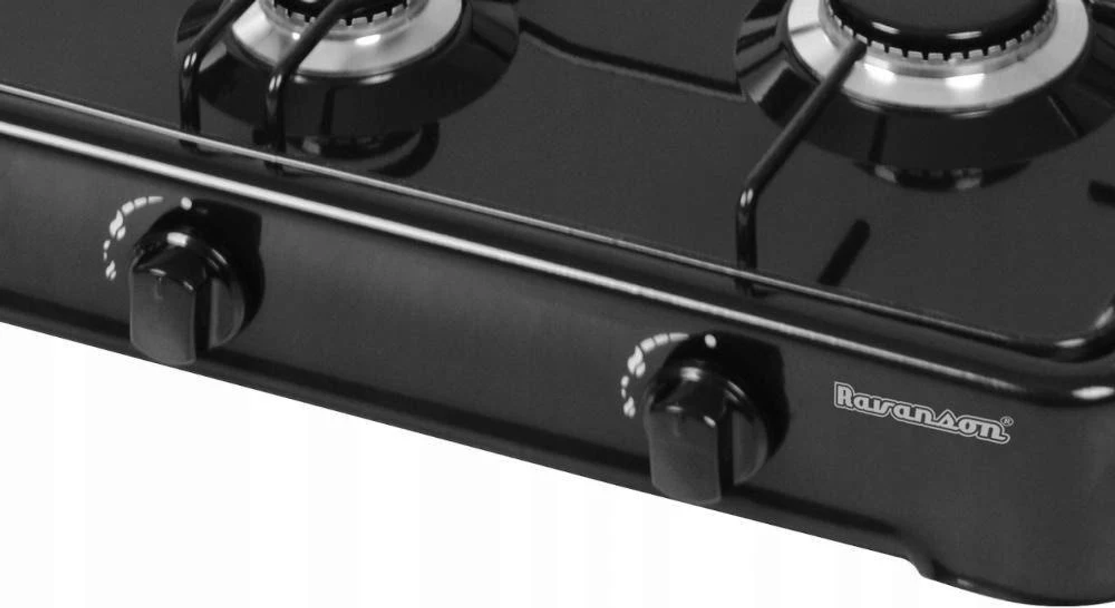 Zbliżenie czarnej kuchenki gazowej z dwoma palnikami i pokrętłami.