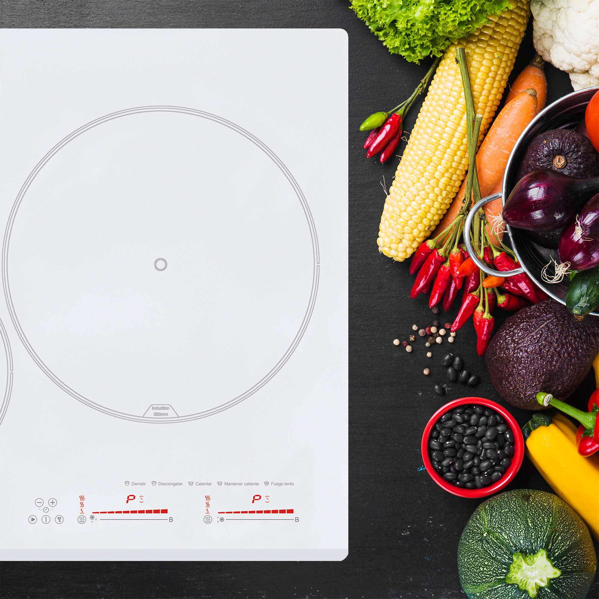 Una placa de cocina blanca con dos quemadores, rodeada de verduras sobre una superficie negra.