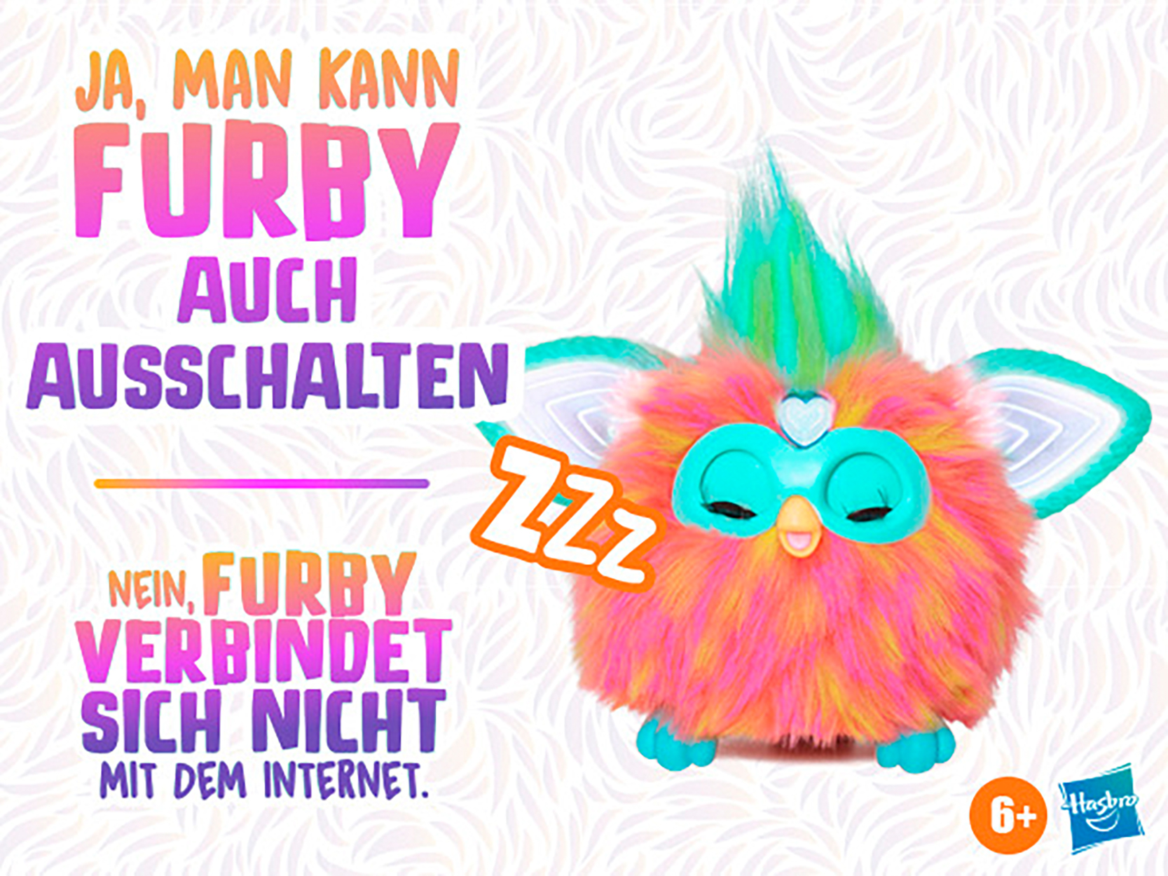 Ein farbenfrohes Furby-Spielzeug mit deutschem Text, einschließlich der Wörter 'Furby' und 'AUS'.