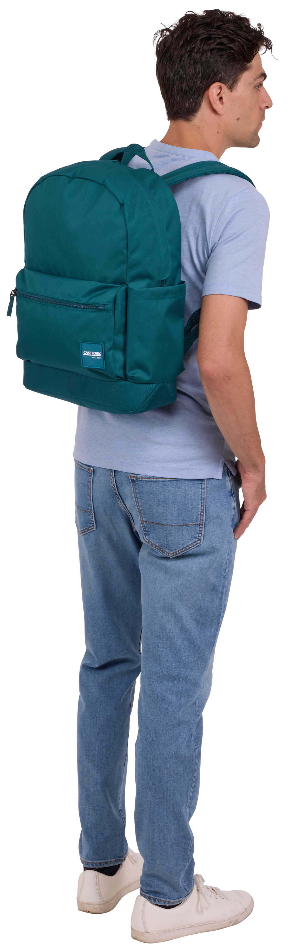 Ein Mann mit einem tealfarbenen Rucksack und Jeans. Er steht mit dem Rücken zur Kamera.