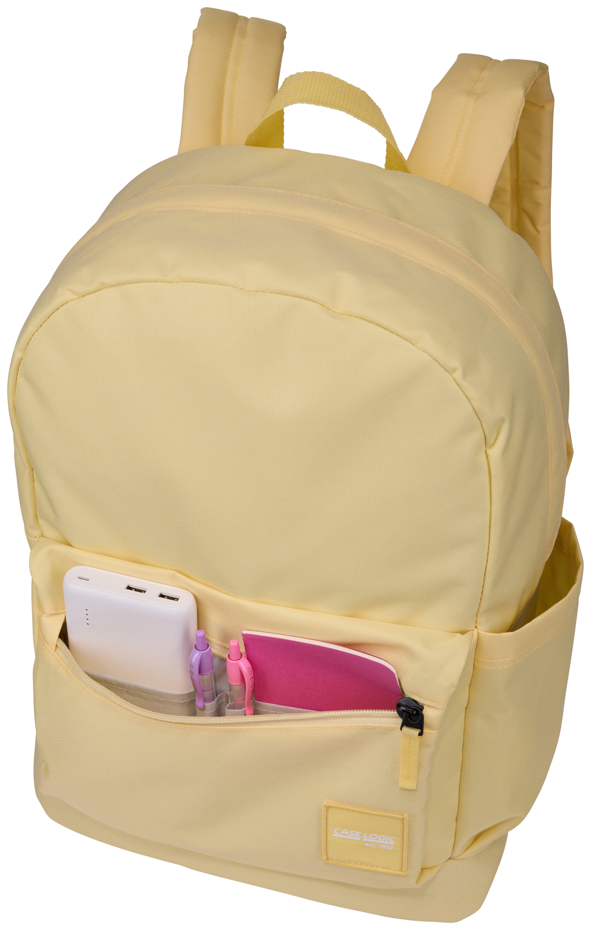 Sac à dos jaune avec plusieurs poches. Contient une batterie externe blanche, un stylo rose et un cahier rose.