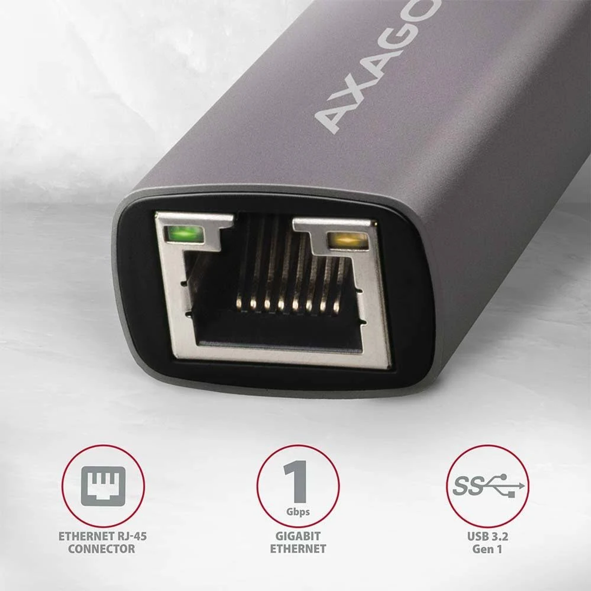 Szary adapter sieciowy z portem ethernet, oznaczony i pokazujący gigabit ethernet.
