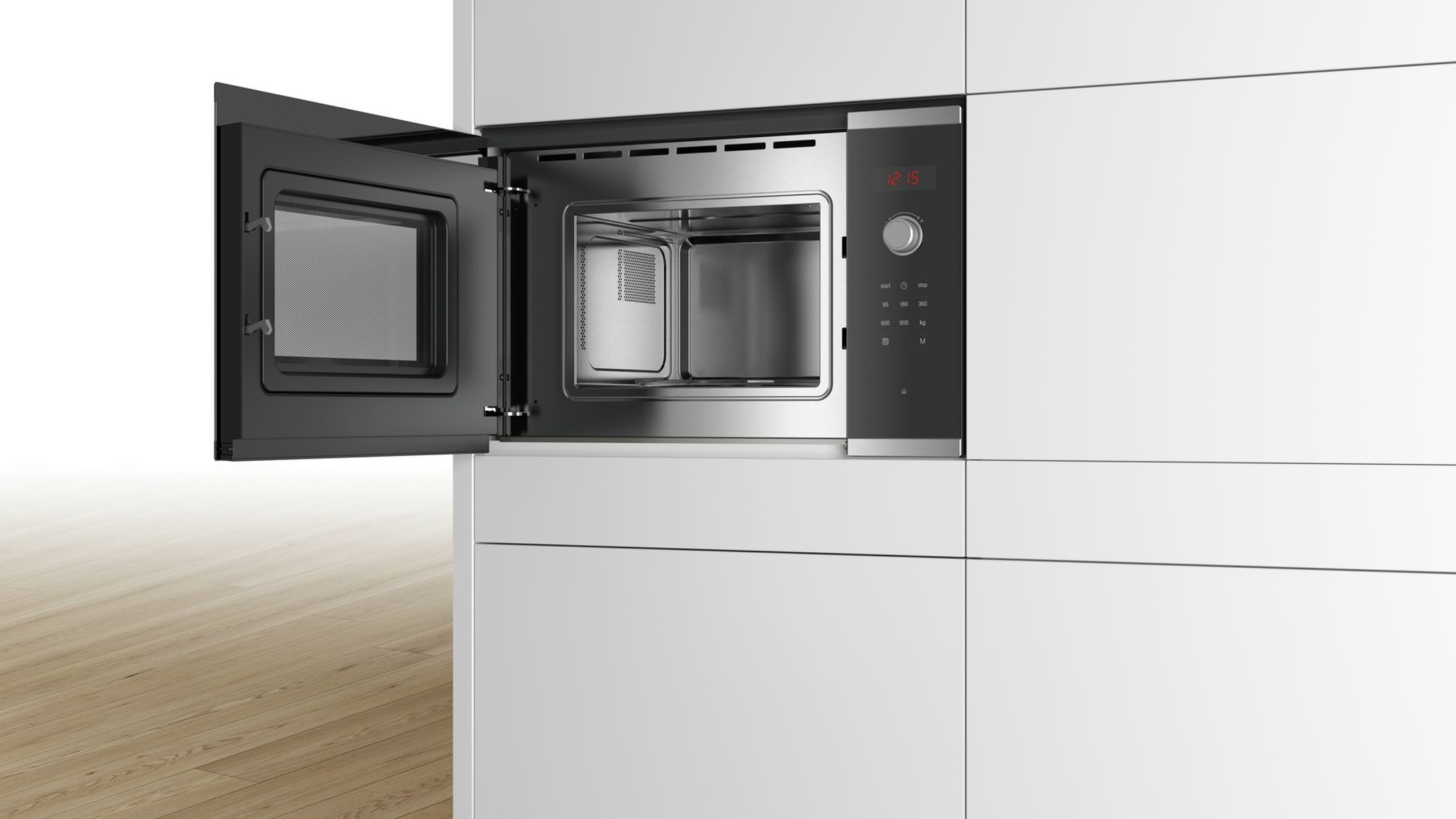 Four à micro-ondes ouvert avec la porte ouverte, montrant l'intérieur et le panneau de commande.