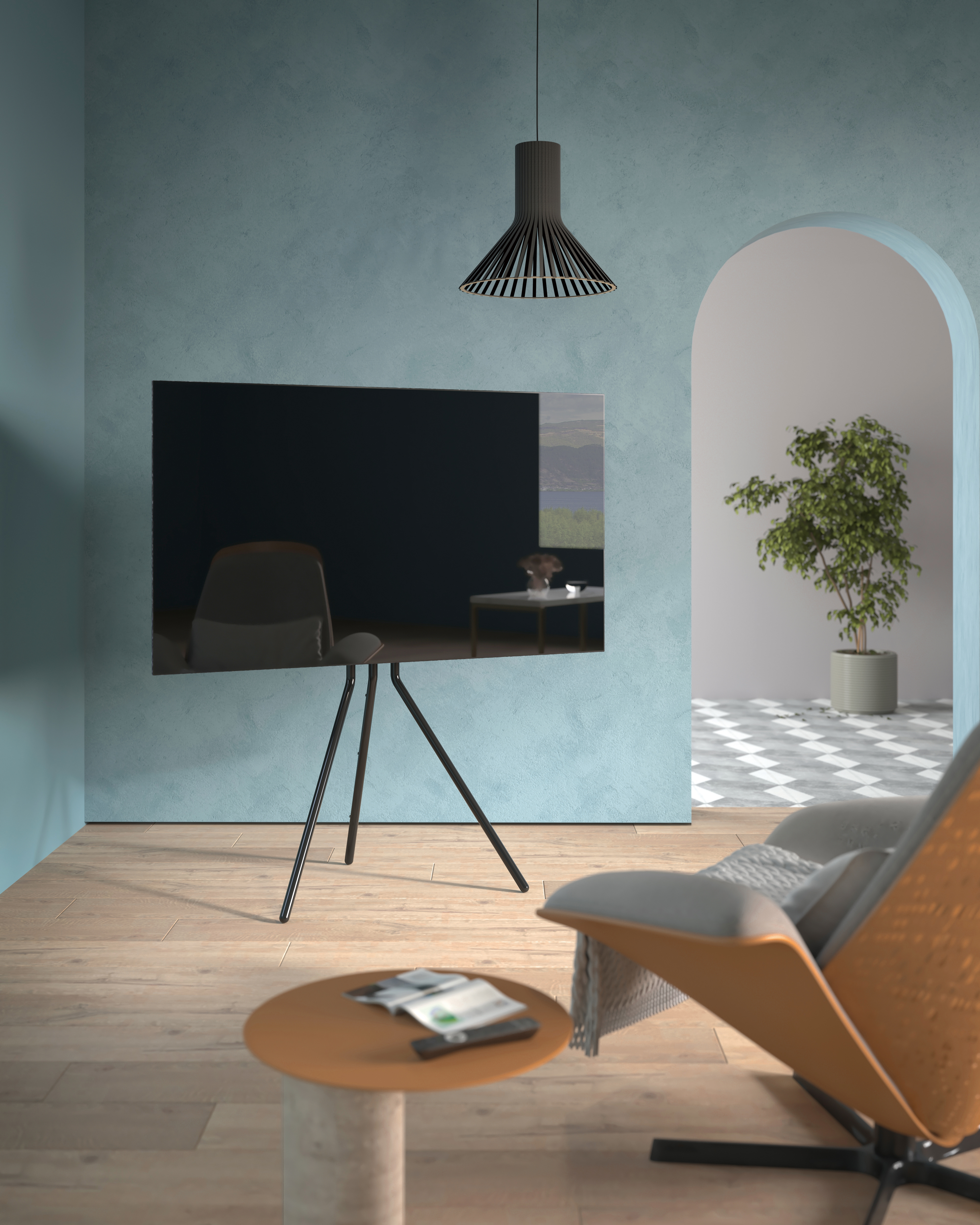 Salón moderno con TV grande en trípode, silla y mesa redonda.