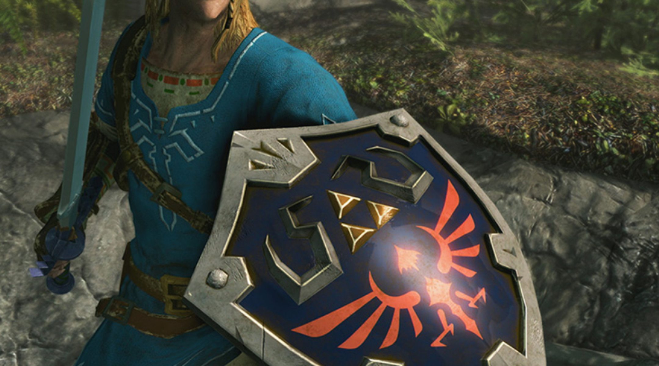 Osoba w niebieskiej tunice trzyma miecz i tarczę z symbolem Triforce.