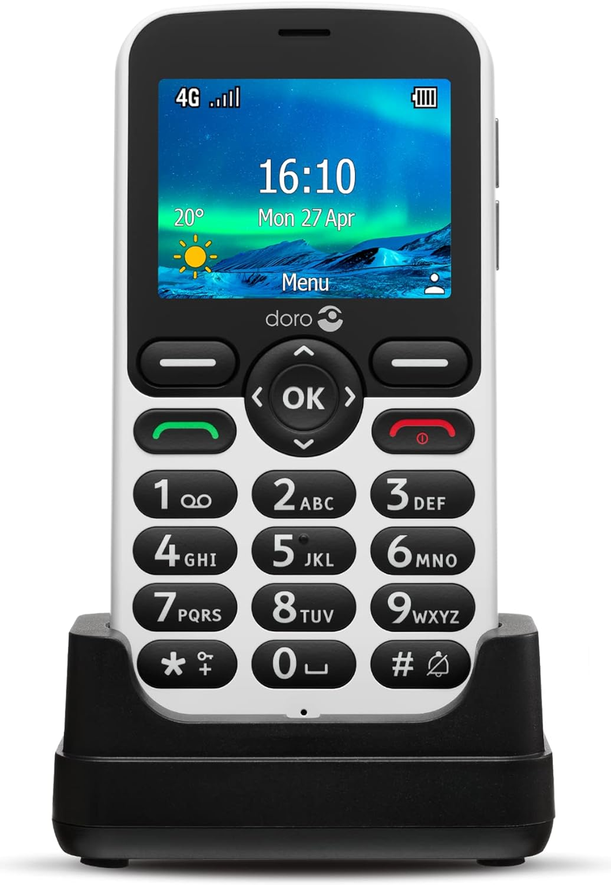 Teléfono móvil blanco y negro en una base de carga. Botones grandes y pantalla con hora.