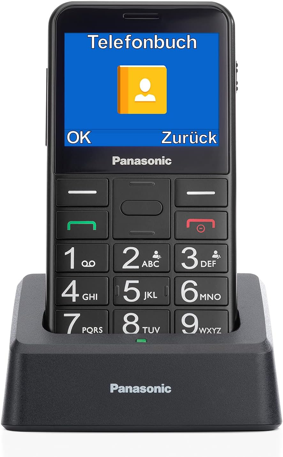 Czarny telefon Panasonic na czarnej stacji ładującej. Ekran wyświetla ikonę książki kontaktowej i tekst w języku niemieckim.