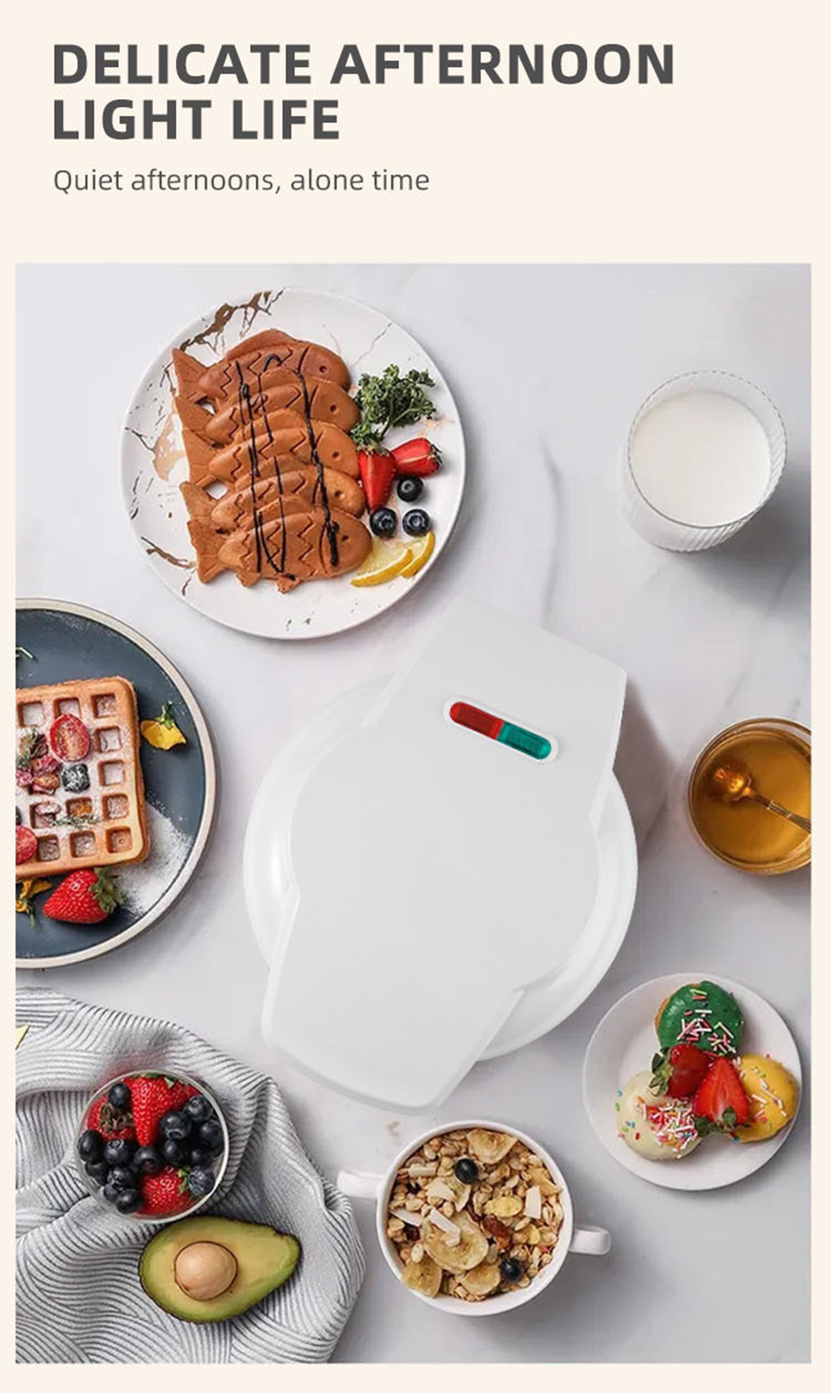 Ein Tisch mit Waffeleisen, Waffeln, Gebäck, Obst und einem Glas Milch.