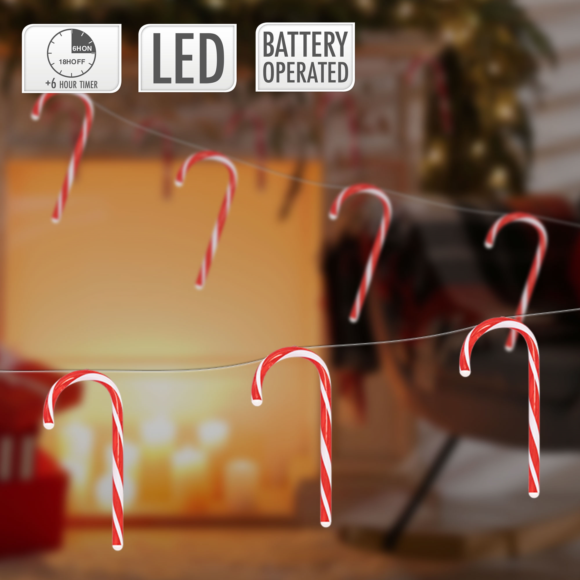 Zuckerstangenlichter. Rote und weiße Zuckerstangen an einem Draht. Festlicher Hintergrund. Batteriebetrieben.