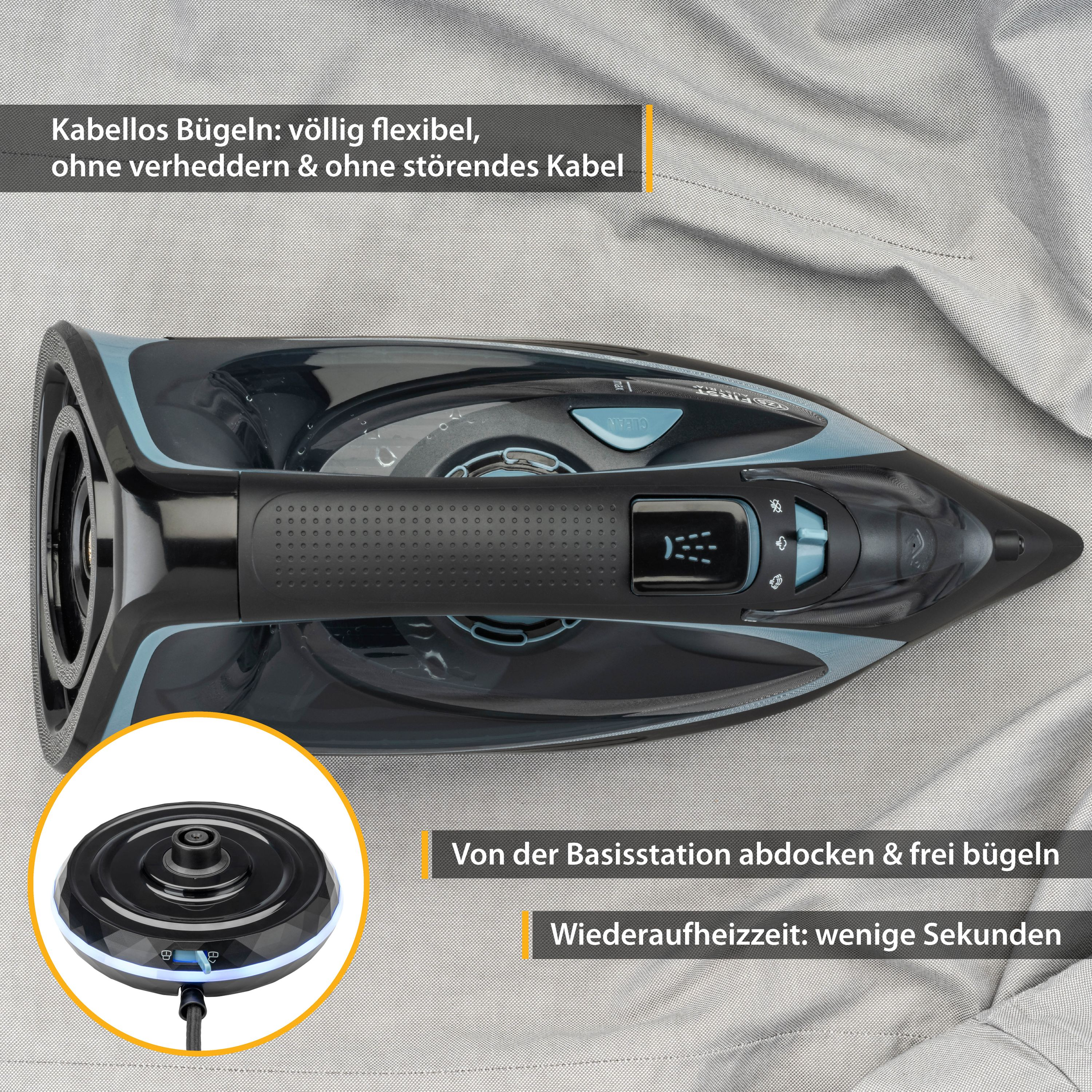Schwarzes und blaues Eisen. Basisstation gezeigt. Bügeleisen auf grauem Stoff.