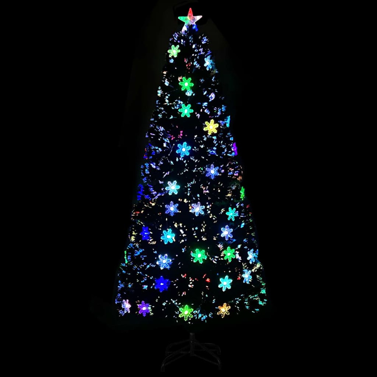 Weihnachtsbaum mit bunten Lichtern im Dunkeln. Stern oben. Schneeflockenlichter.