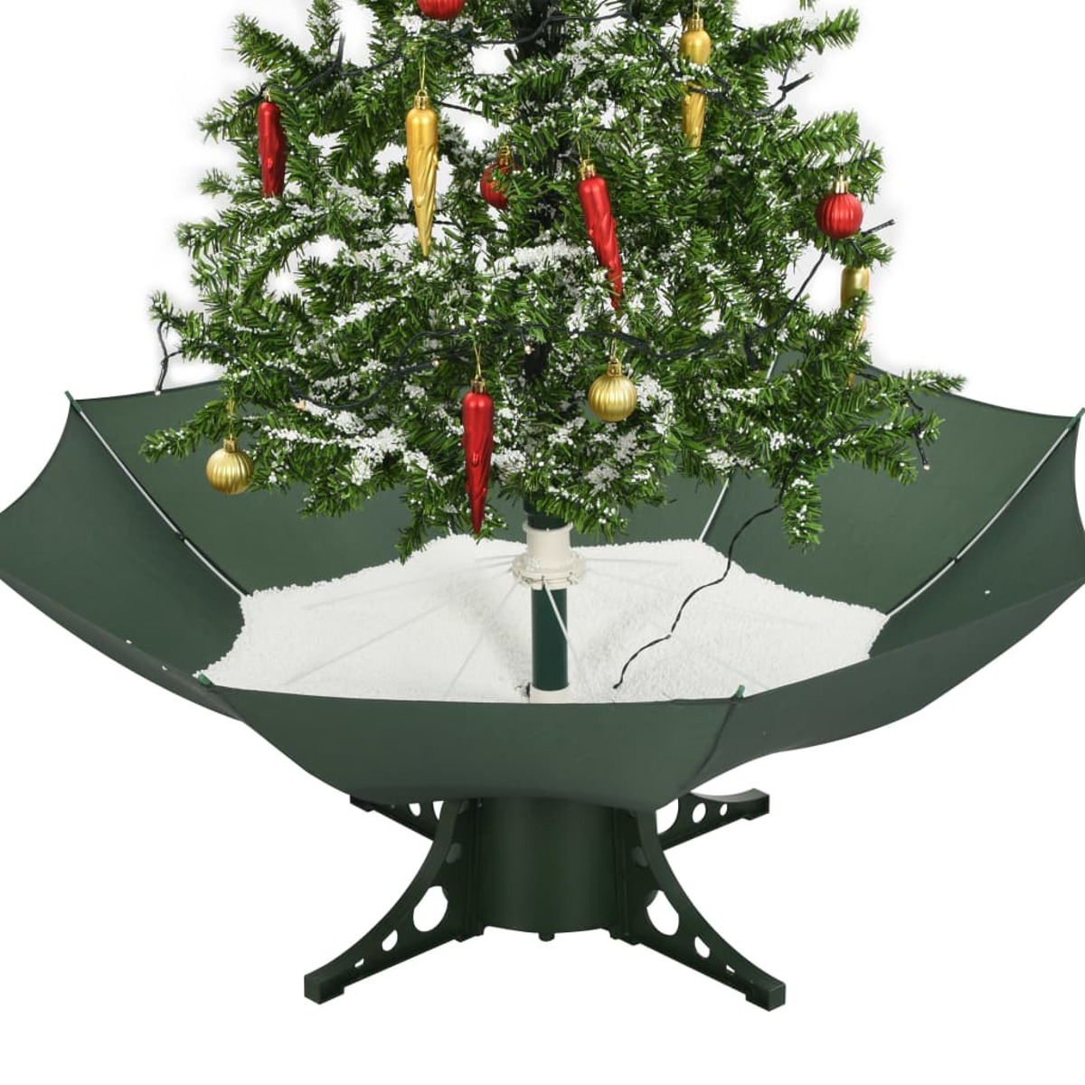 Weihnachtsbaum in grünem, schirmförmigen Sockel. Mit Ornamenten dekoriert und mit Kunstschnee bedeckt.