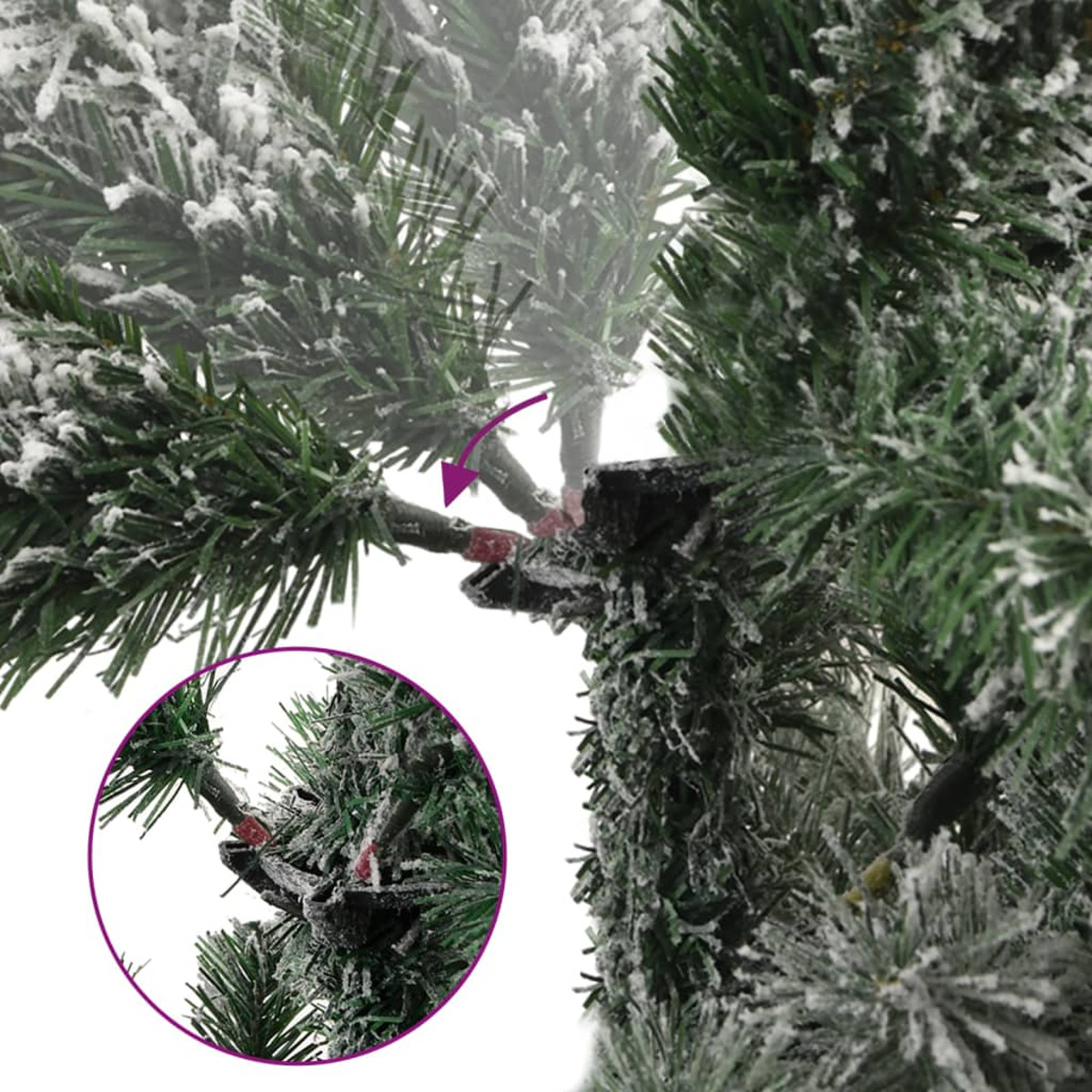 Nahaufnahme eines Weihnachtsbaumzweigs mit Schnee. Ein rotes Gelenk sichtbar.