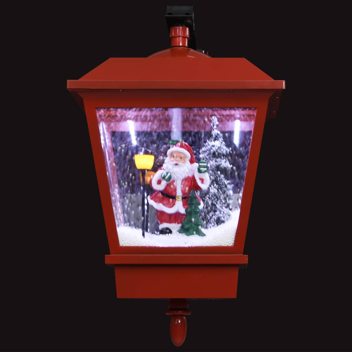 Rote Weihnachtslaterne mit Weihnachtsmann, Schneeeffekt. Schwarzer Hintergrund, festliche Szene.