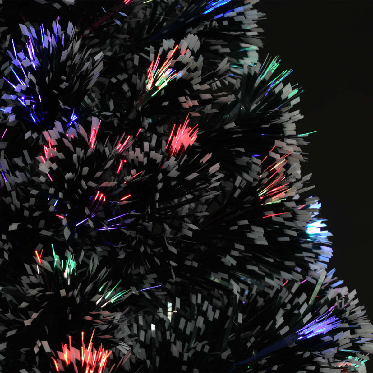 Nahaufnahme eines schwarz-weißen Glasfaser-Weihnachtsbaums mit bunten Lichtern.