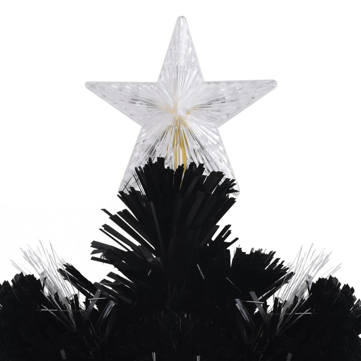 Nahaufnahme eines Sterns auf einem schwarzen Weihnachtsbaum.