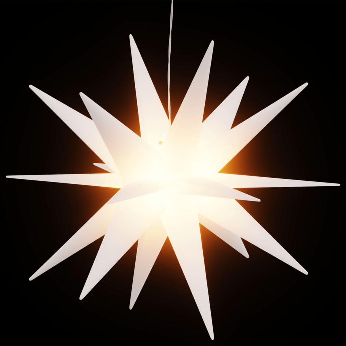 Weihnachtsdekoration in Form eines weißen Sterns mit hellem Zentrum.