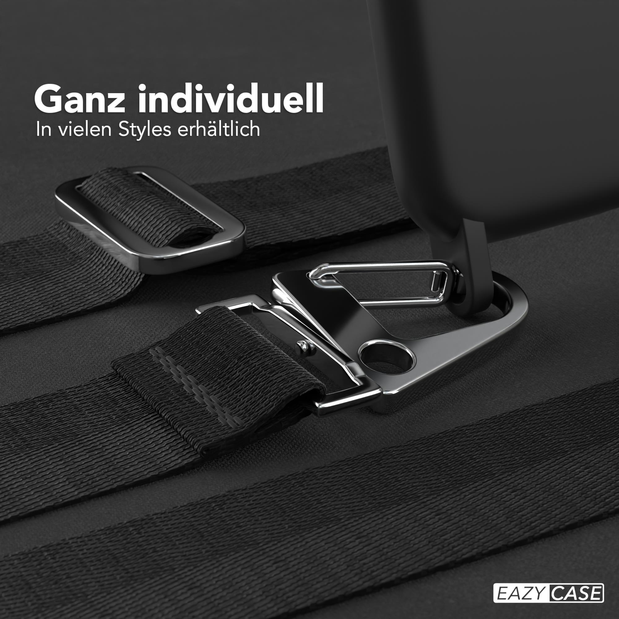 Nahaufnahme eines schwarzen Gurtbands mit Metallverschluss. Text: Ganz individuell, in vielen Styles erhältlich.