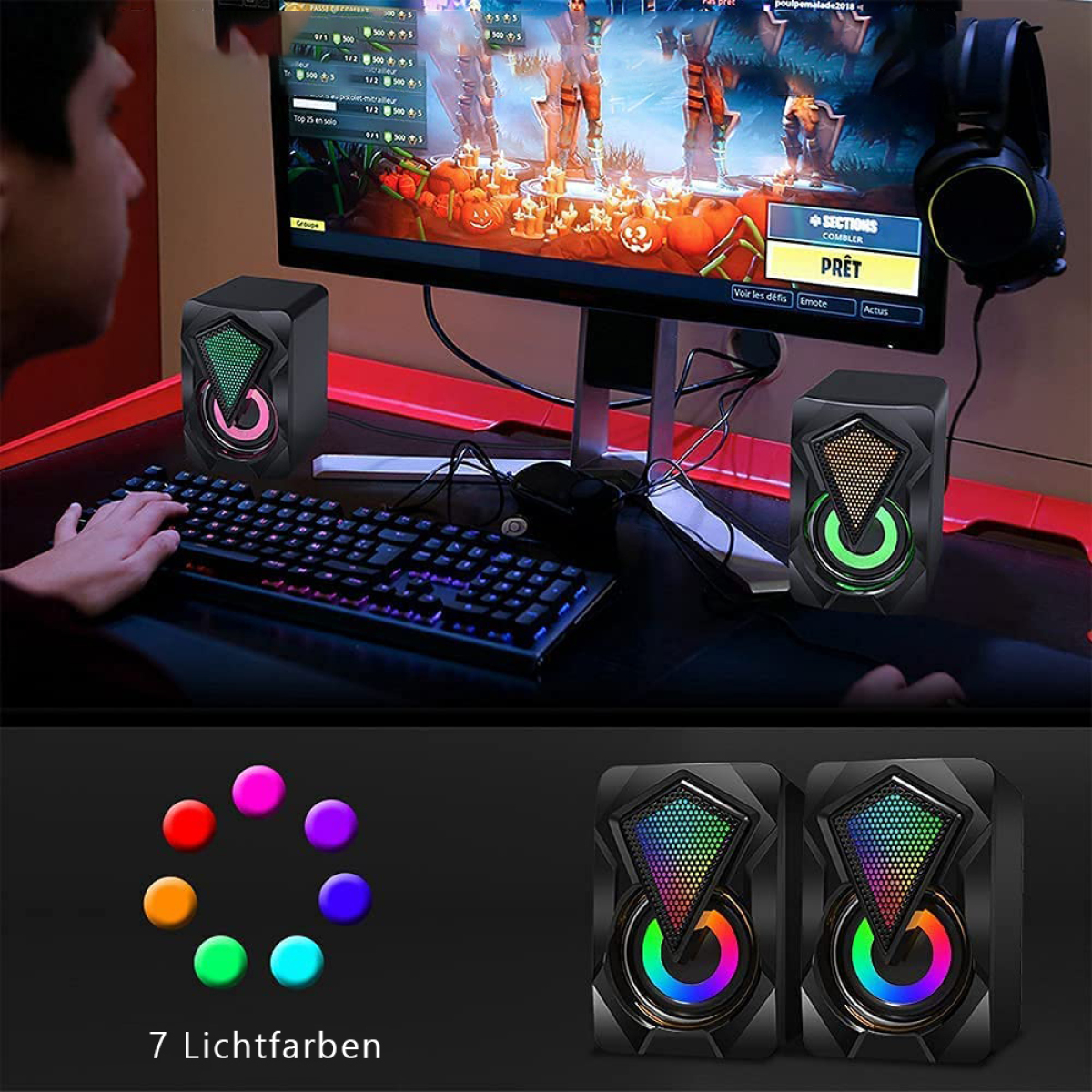 Zwei schwarze Lautsprecher mit bunten Lichtern und eine Tastatur auf einem Schreibtisch.