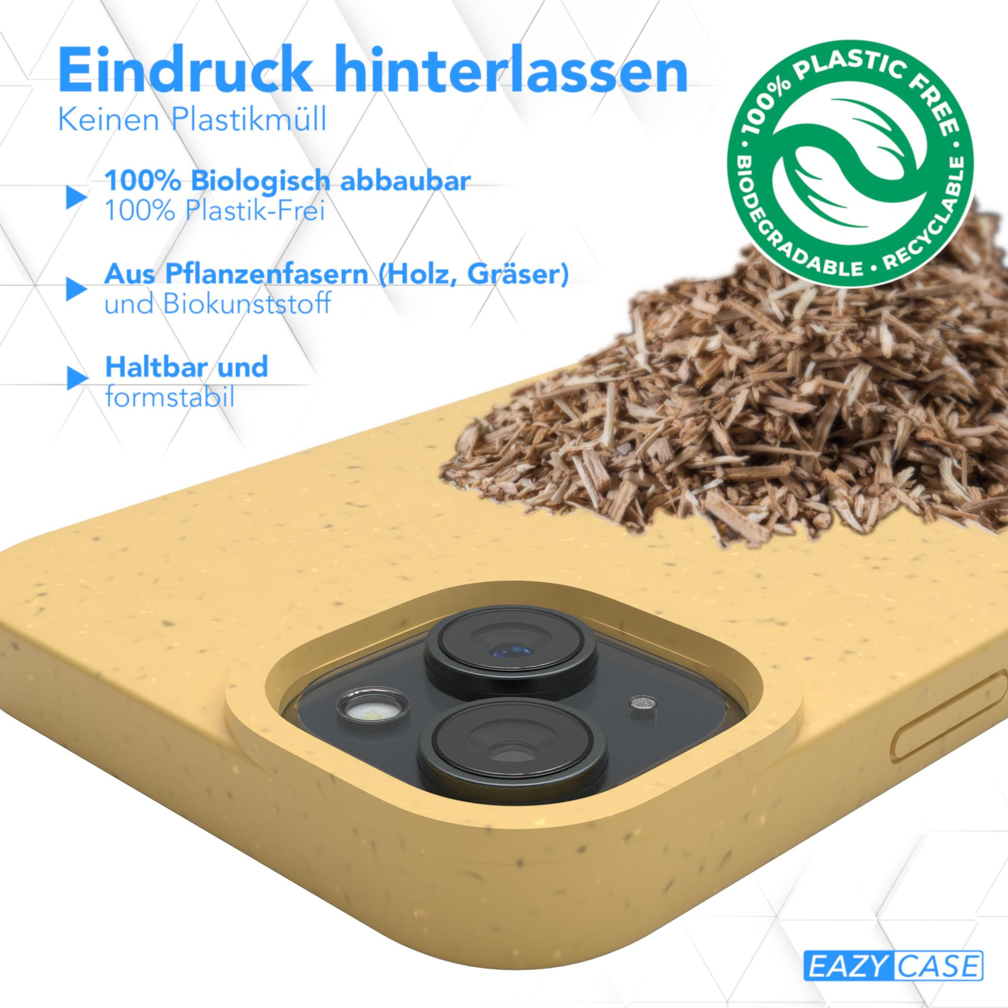 Gelbe Handyhülle mit Holzspänen und Text über biologische Abbaubarkeit und Kunststofffreiheit. Die Hülle liegt auf Holzspänen.
