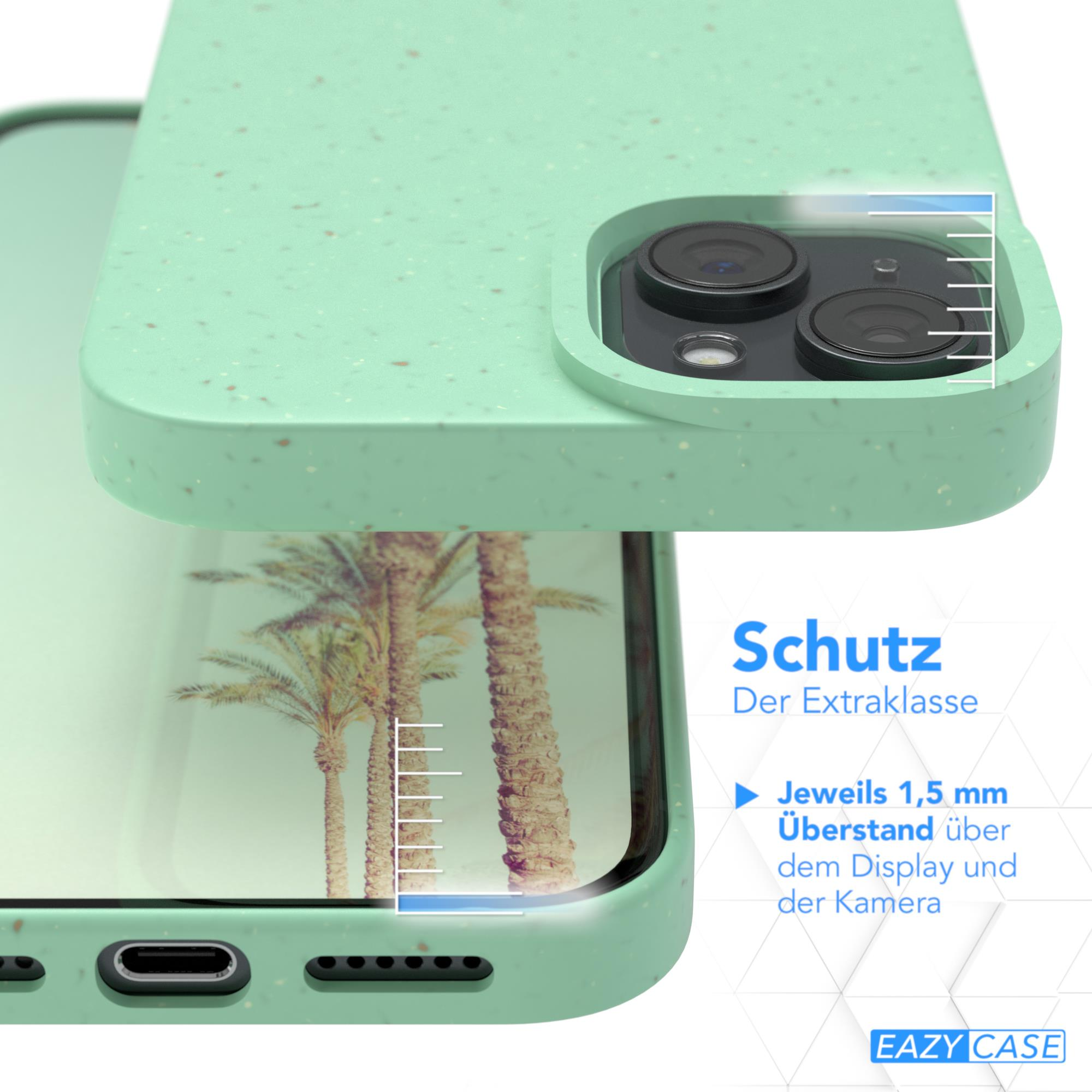 Minzgrüne Handyhülle schützt ein Telefon, Palmen im Hintergrund sichtbar.