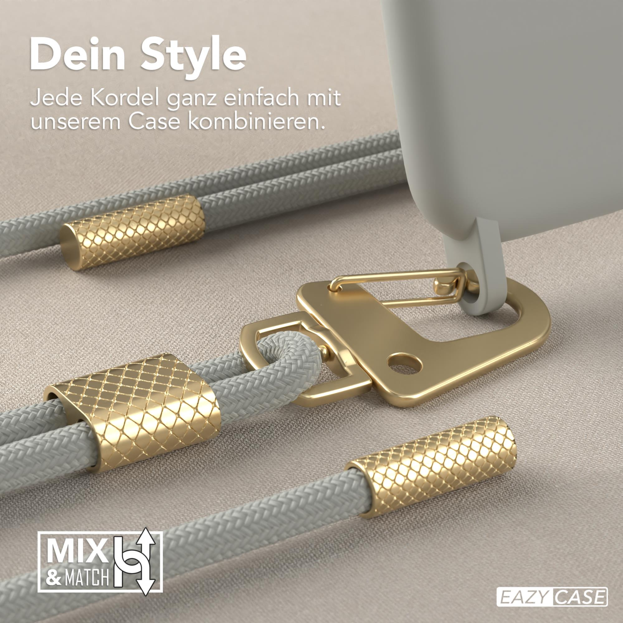 Nahaufnahme einer Handyhülle mit goldenem Verschluss und grauem Kordel. Goldene Dekorationen sind sichtbar.