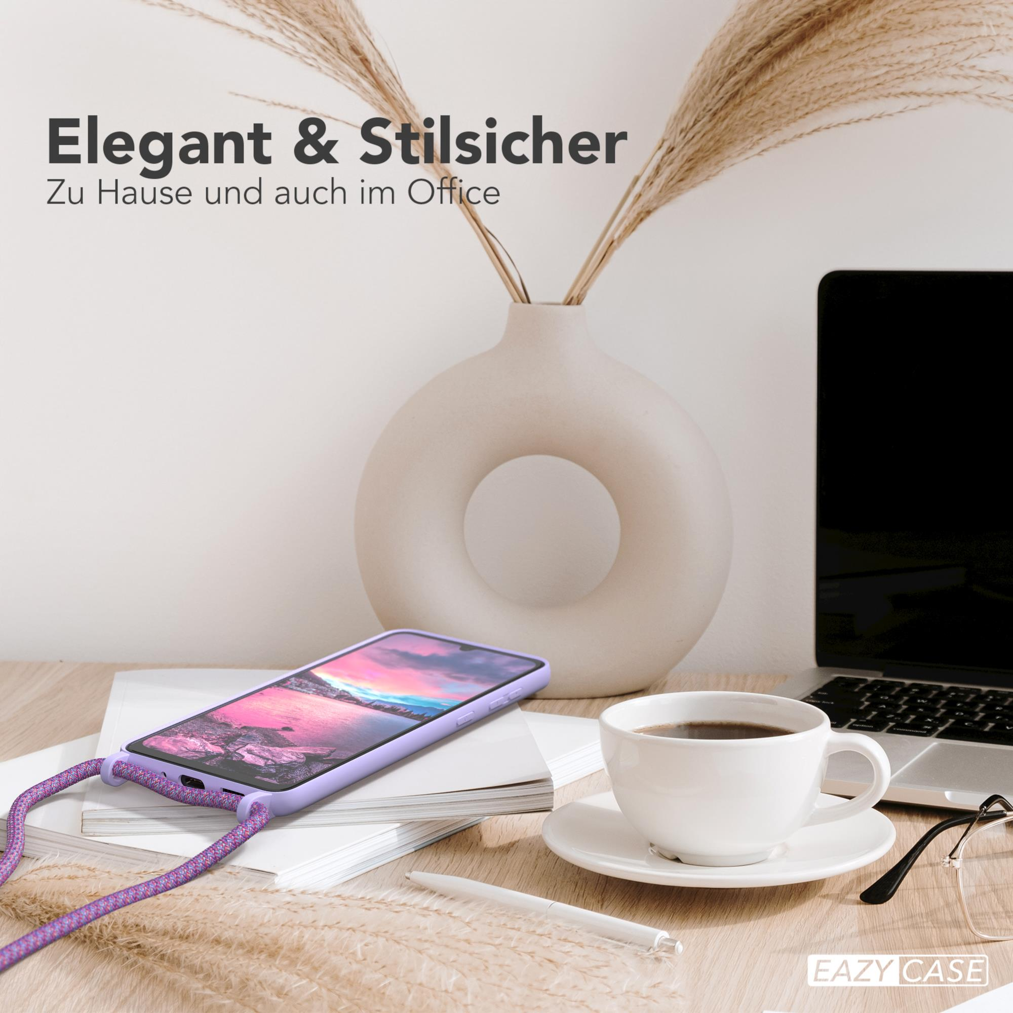 Eine Handyhülle auf einem Schreibtisch mit Kaffee und einem Laptop. Text: Elegant & Stilsicher, Eazy Case. Vase mit Pflanzen.