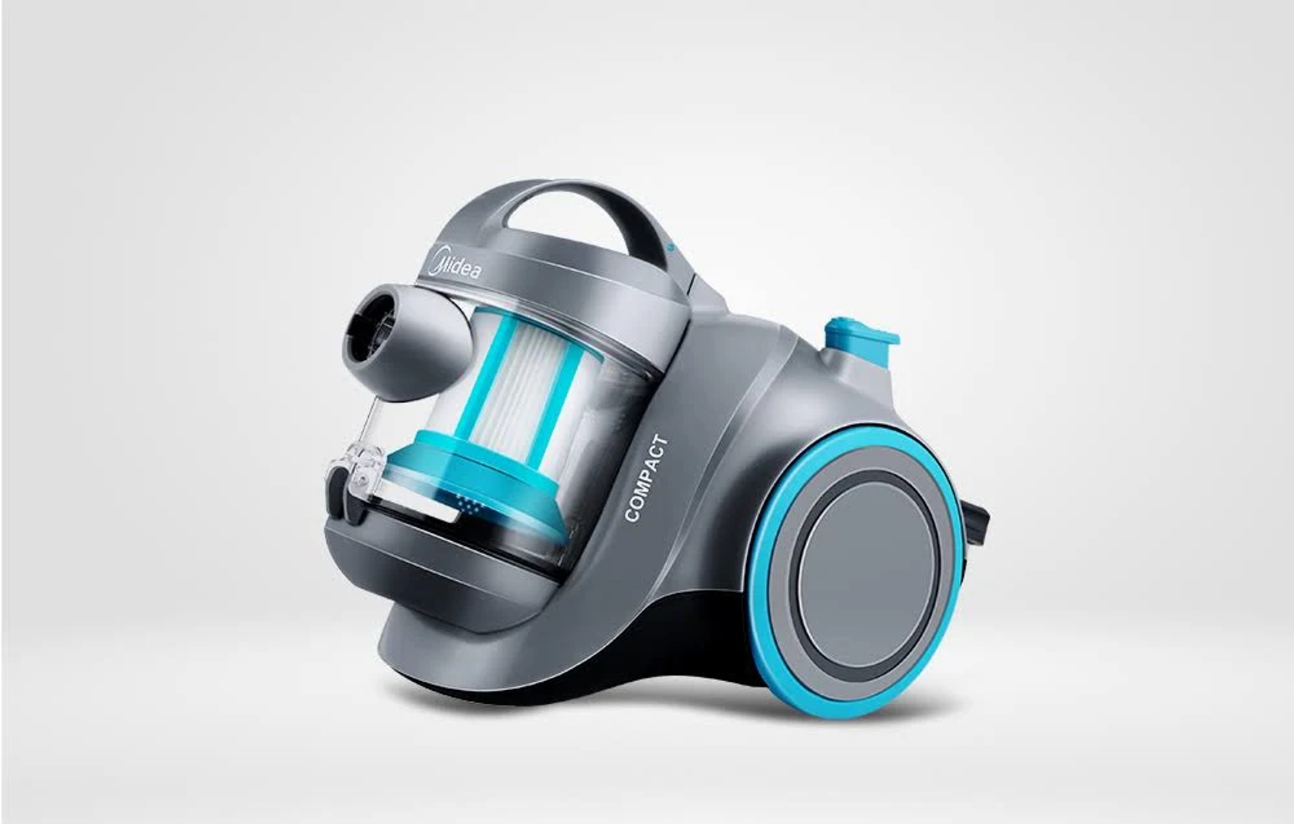 Un aspirapolvere grigio con accenti blu. La parola 'COMPACT' è sul corpo.