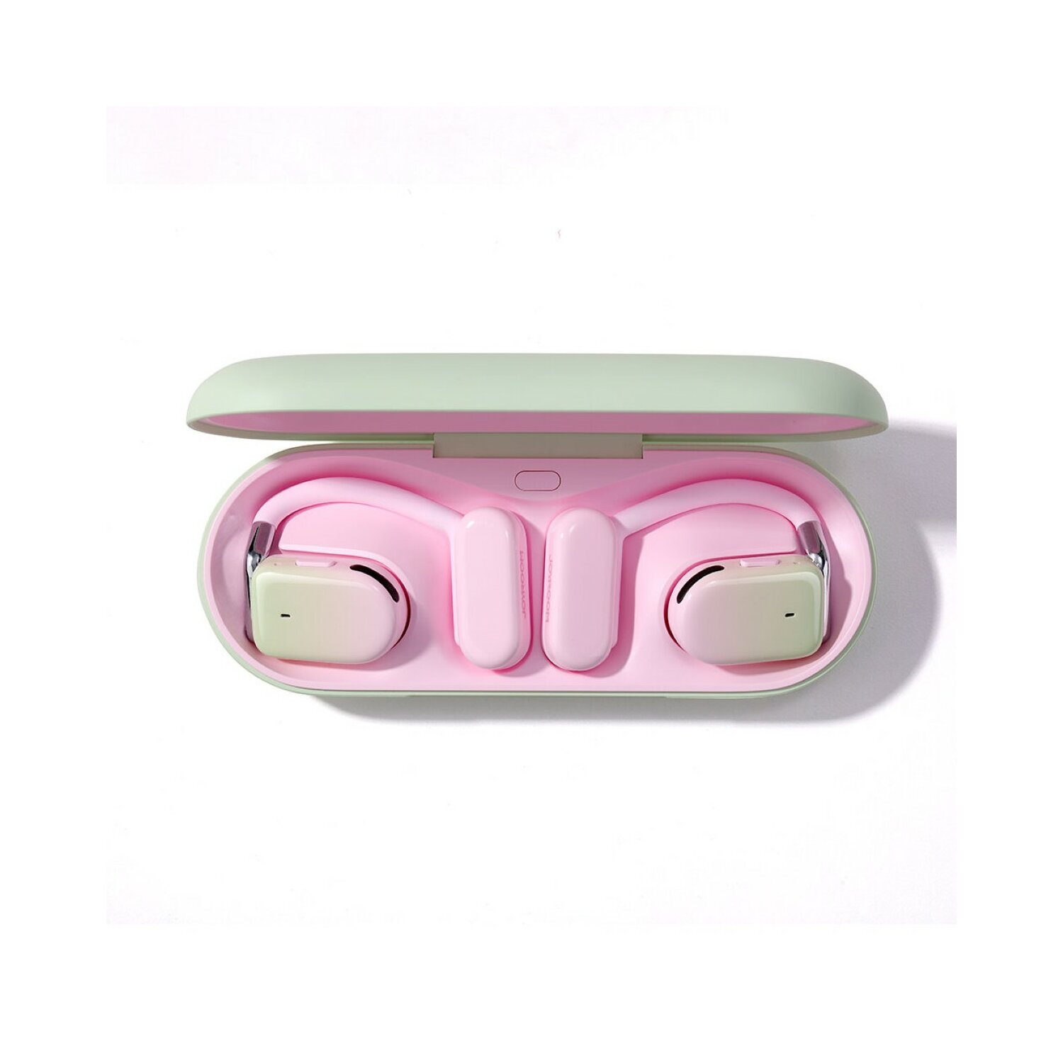Auricolari wireless rosa e bianchi all'interno di una custodia di ricarica verde.