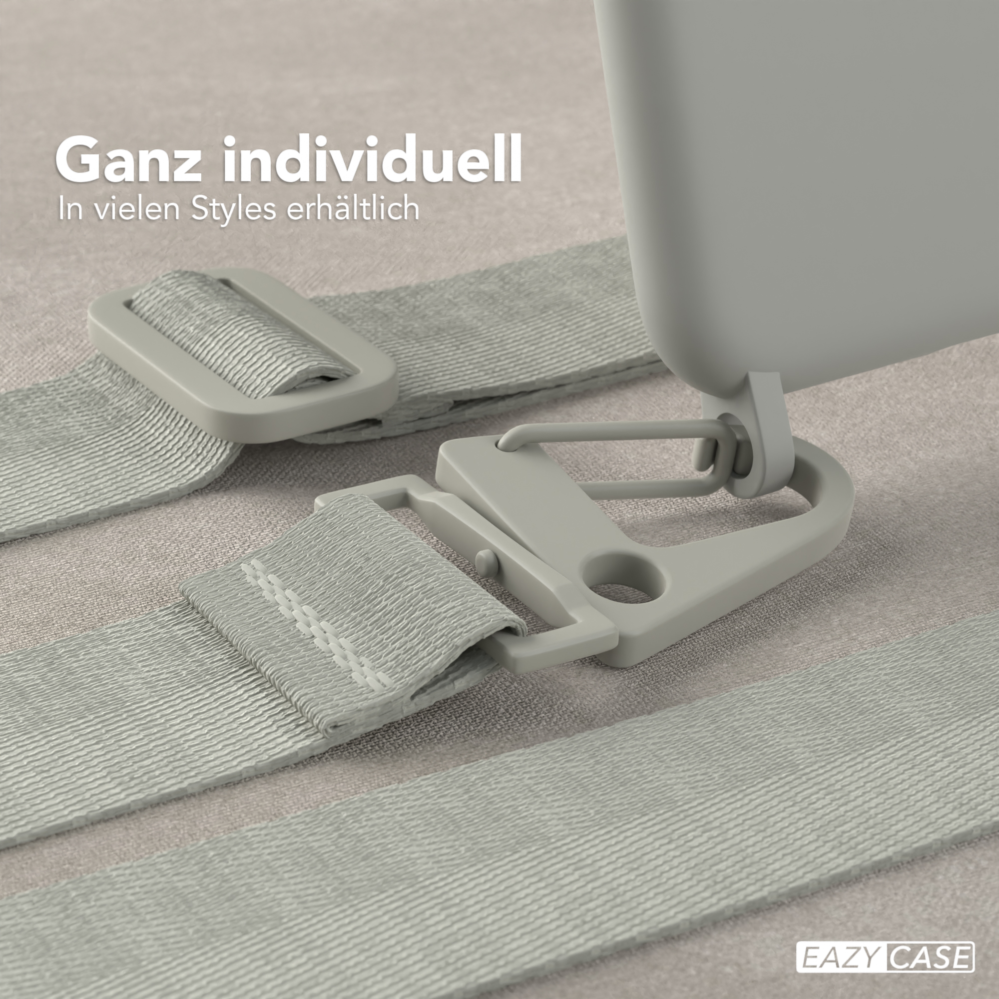 Nahaufnahme von grauen Handyhüllen-Gurtverbindern. Die Verbinder sind an einem hellfarbigen Gurt befestigt.