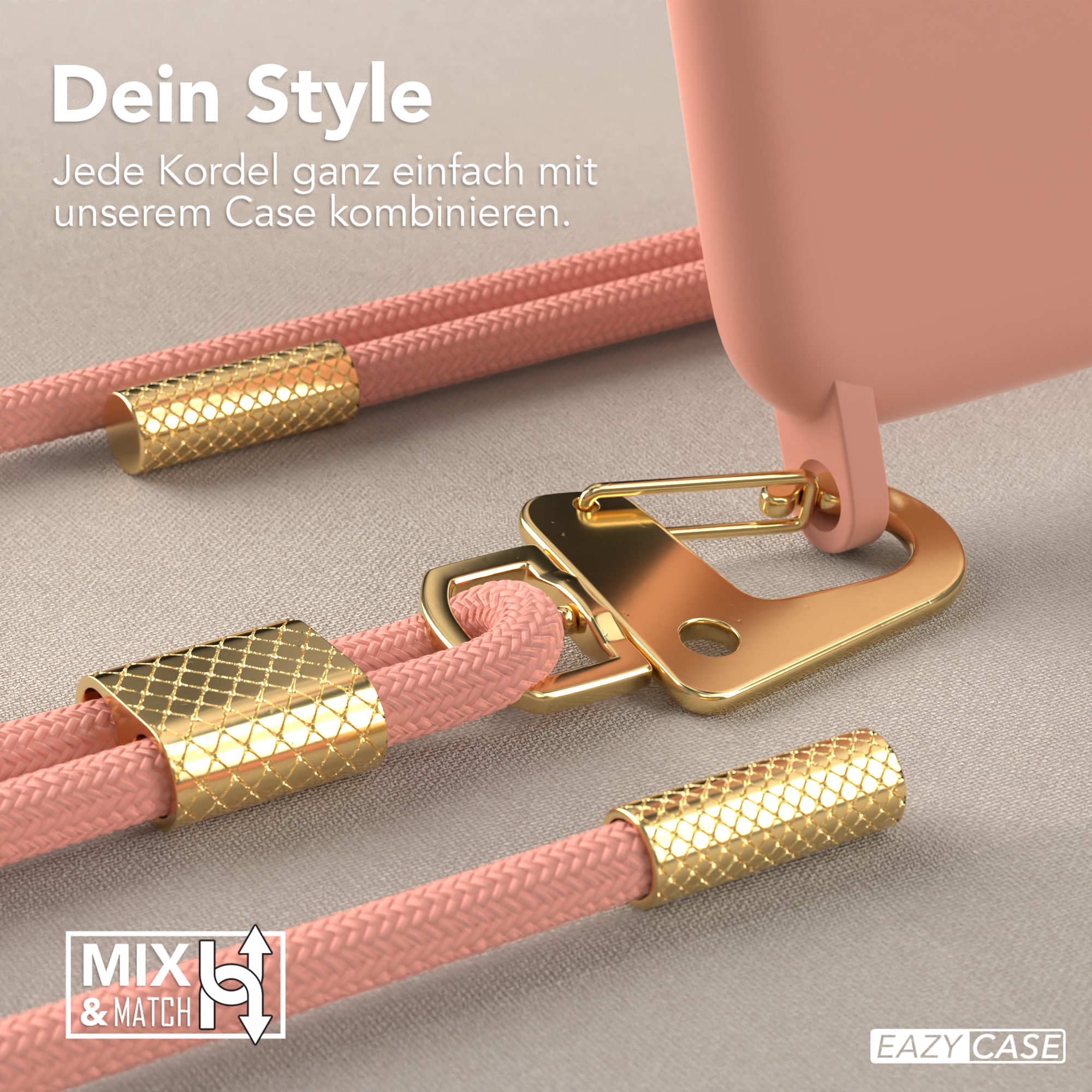 Nahaufnahme von Handyhülle und Gurtbefestigungen. Korallenfarbenes Band mit goldenen Metallakzenten.