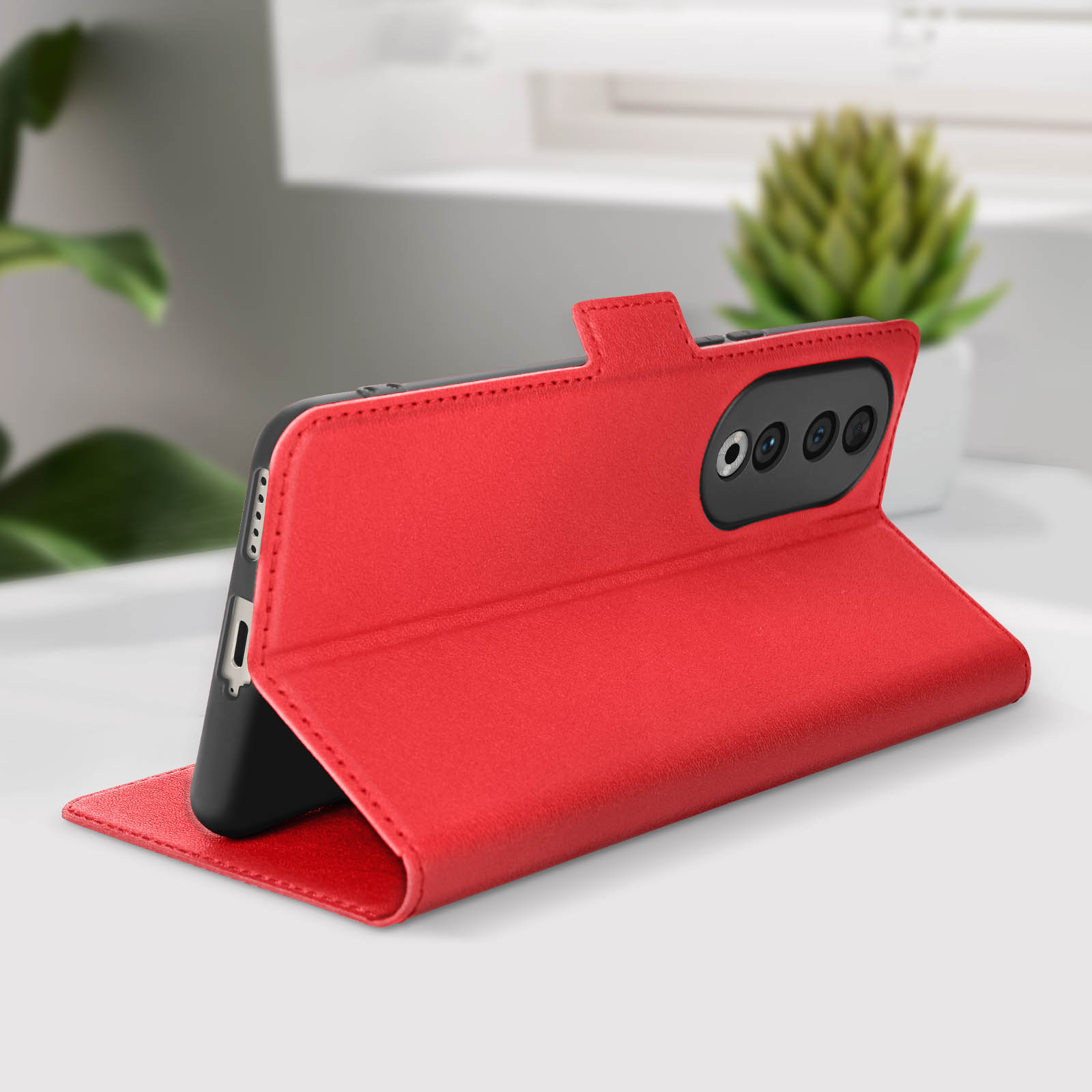 Custodia rossa aperta, mostra un telefono. La custodia ha un lembo magnetico, le fotocamere del telefono sono visibili.