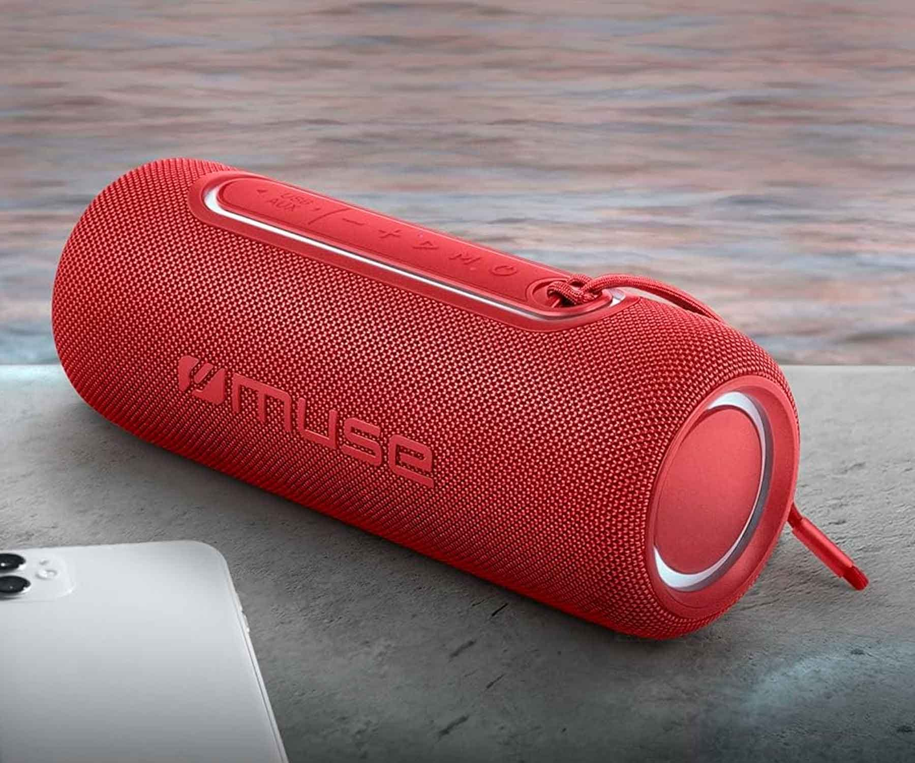 Un altavoz cilíndrico rojo con la marca 'VMuse'.