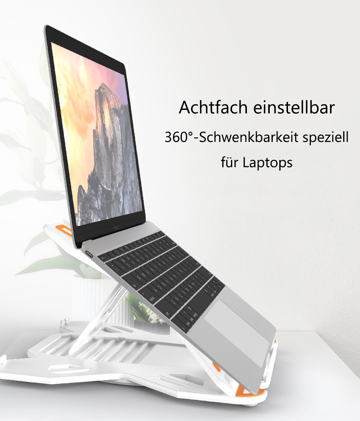 Ein Laptop auf einem weißen Laptopständer mit orangefarbenen Akzenten.