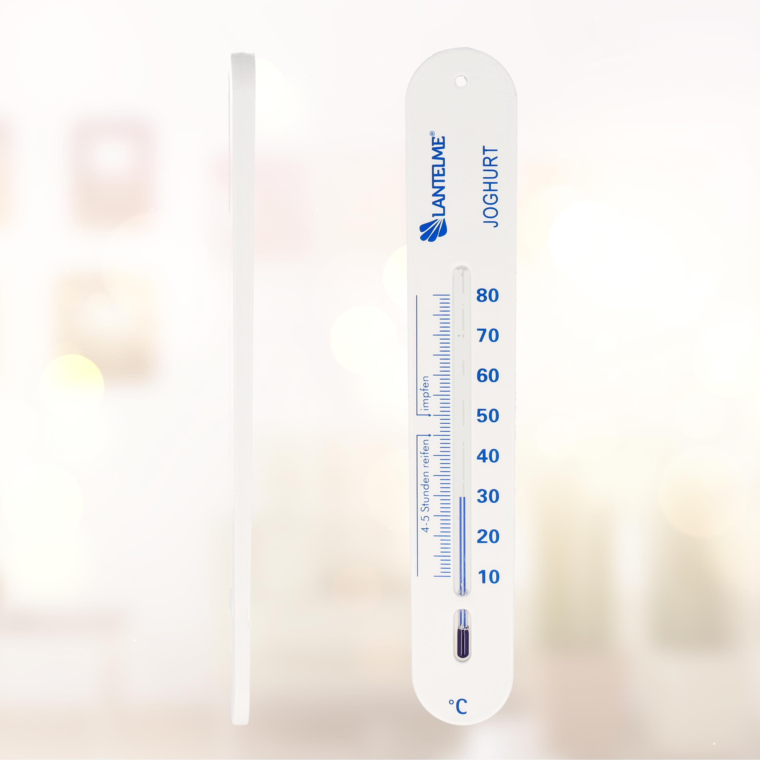 Weißes Thermometer mit blauer Flüssigkeit, misst 4,5 Stunden, mit dem Text 'Joghurt'.