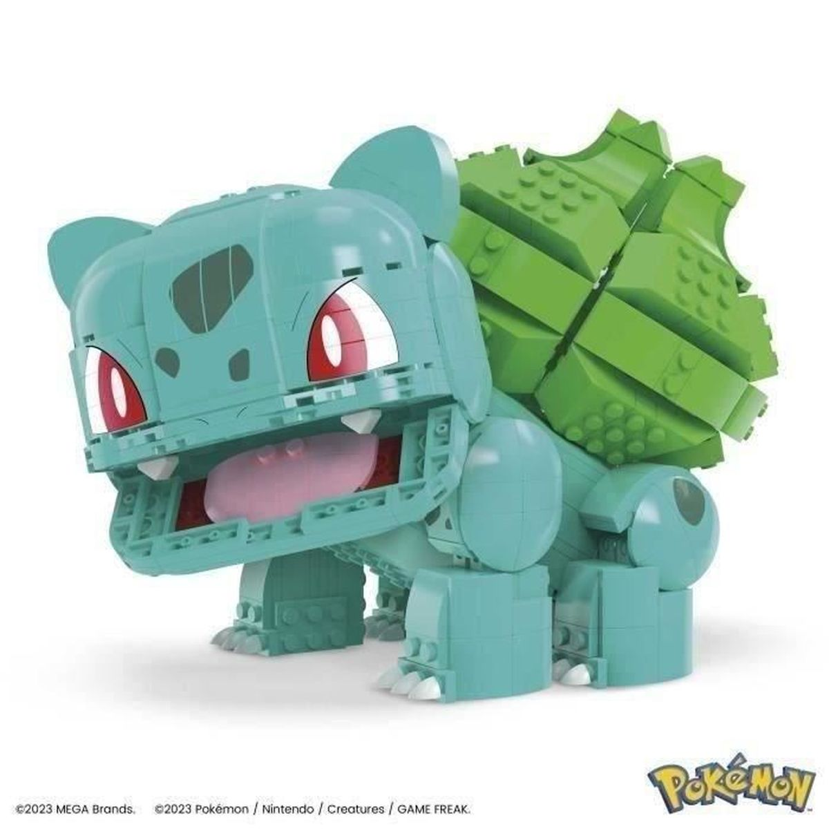 Zabawka Pokemon Bulbasaur, jasnoniebieska z zielonymi akcentami, otwarte usta.